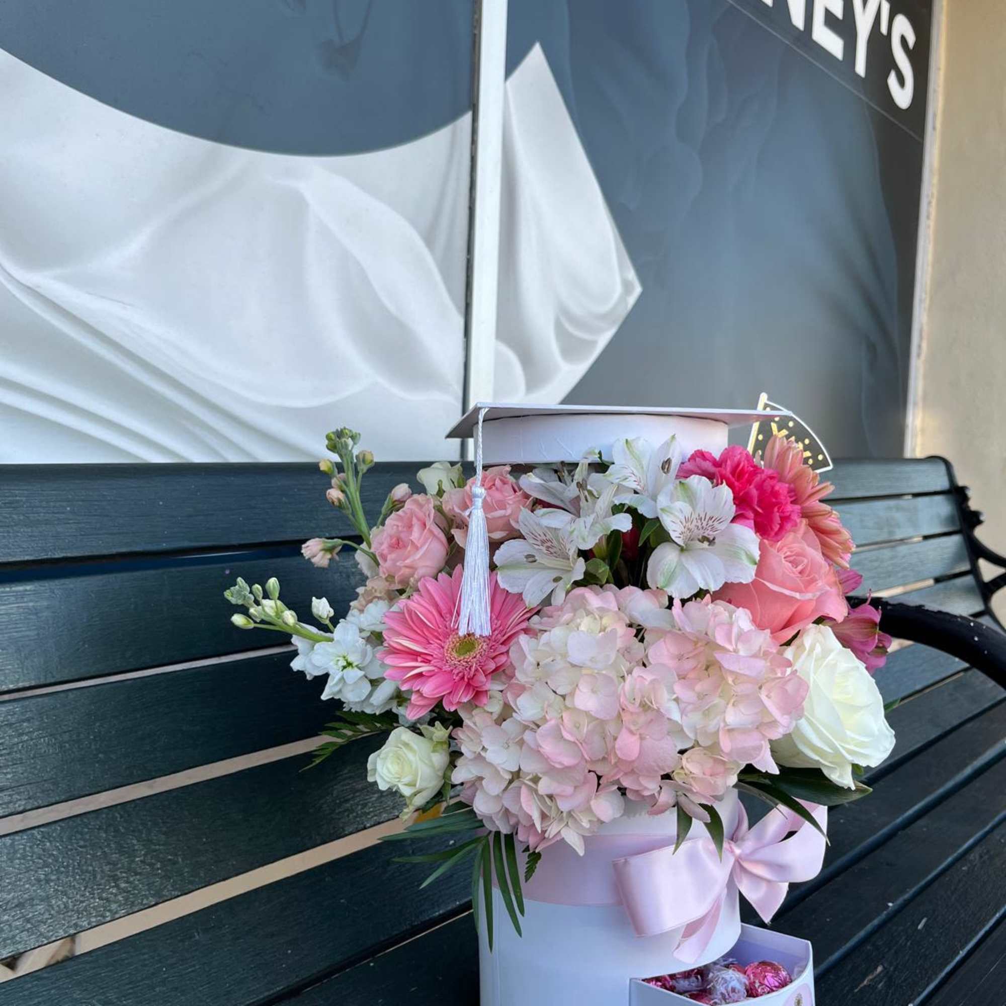 Blooming Graduation Cap with premium fresh cuts and Chocolate 
.