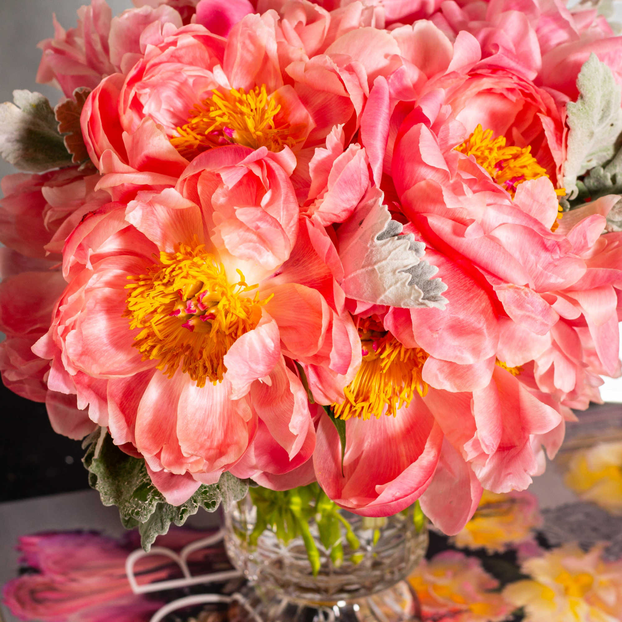Embrace the enchanting beauty of a floral masterpiece where delicate peonies, each