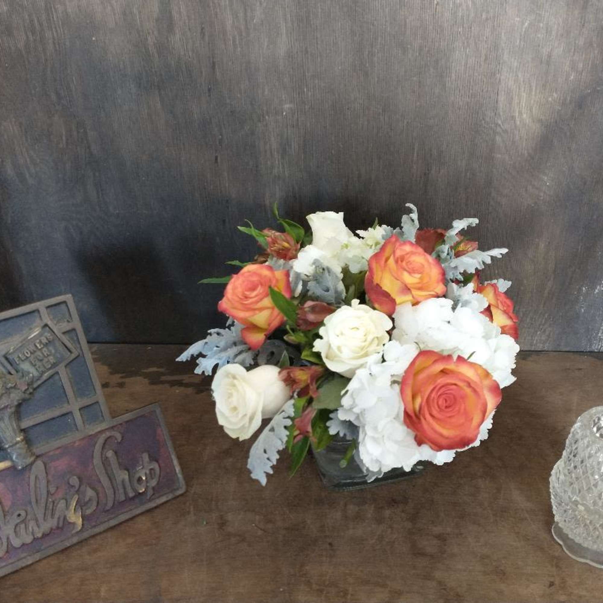 Hydrangeas, Roses, Alstroemeria in a low clear vase