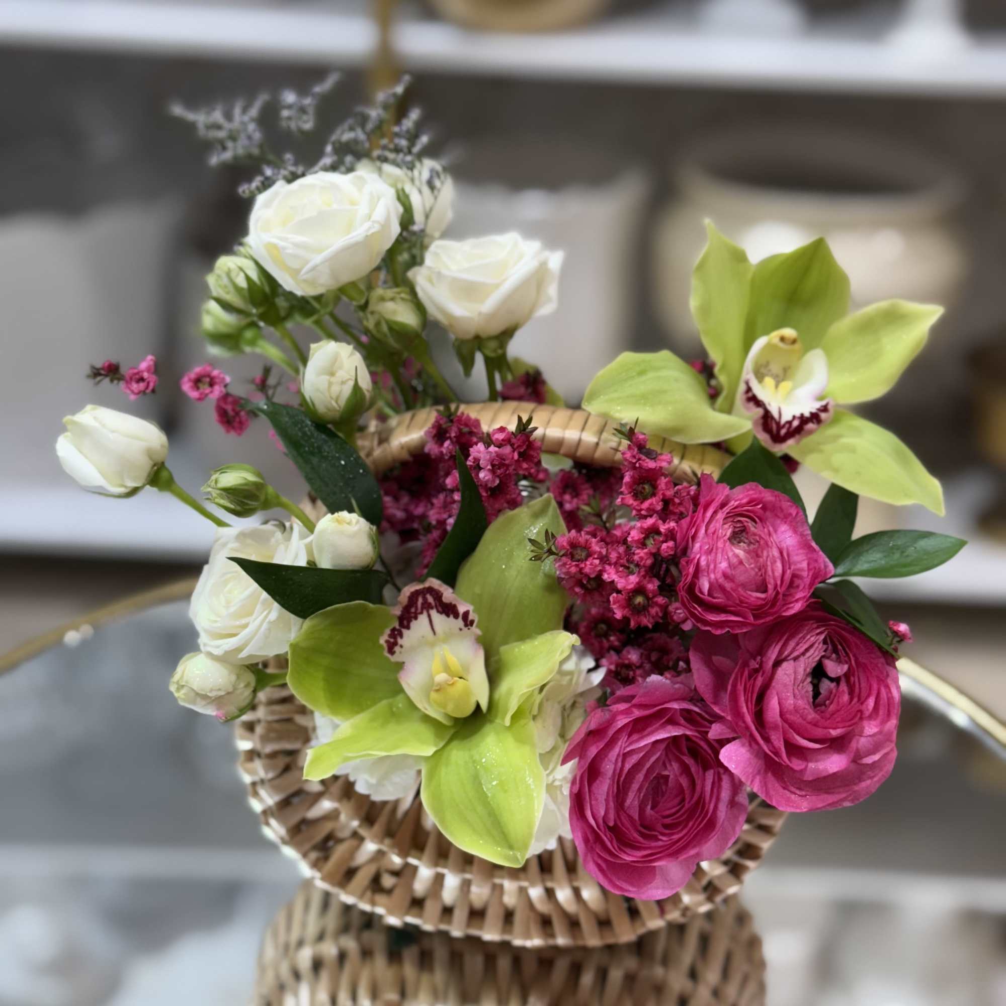 A beautiful mix of spring flowers in stylish basket   A beautiful mix of spring flowers in stylish basket