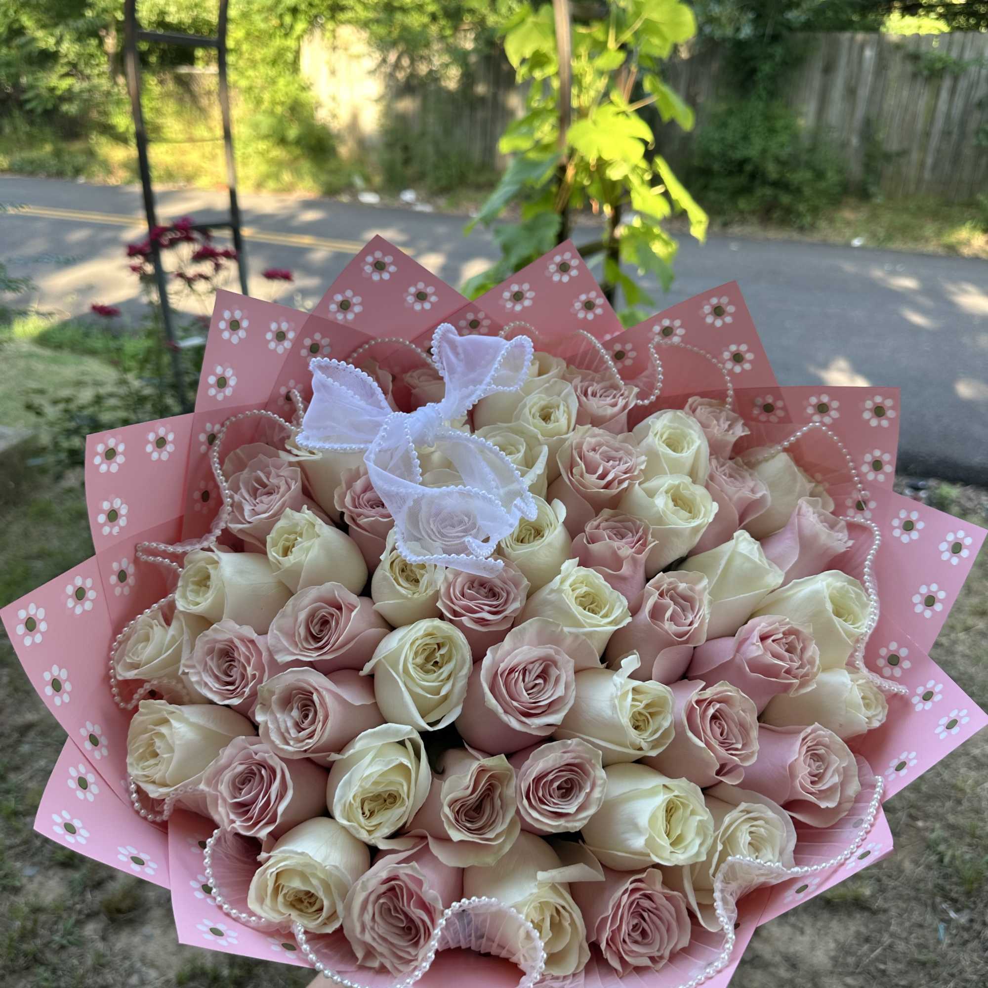  rose wrapped bouquet.

Rose color available:
Red 
Pink
Hot Pink
White

If you want to request