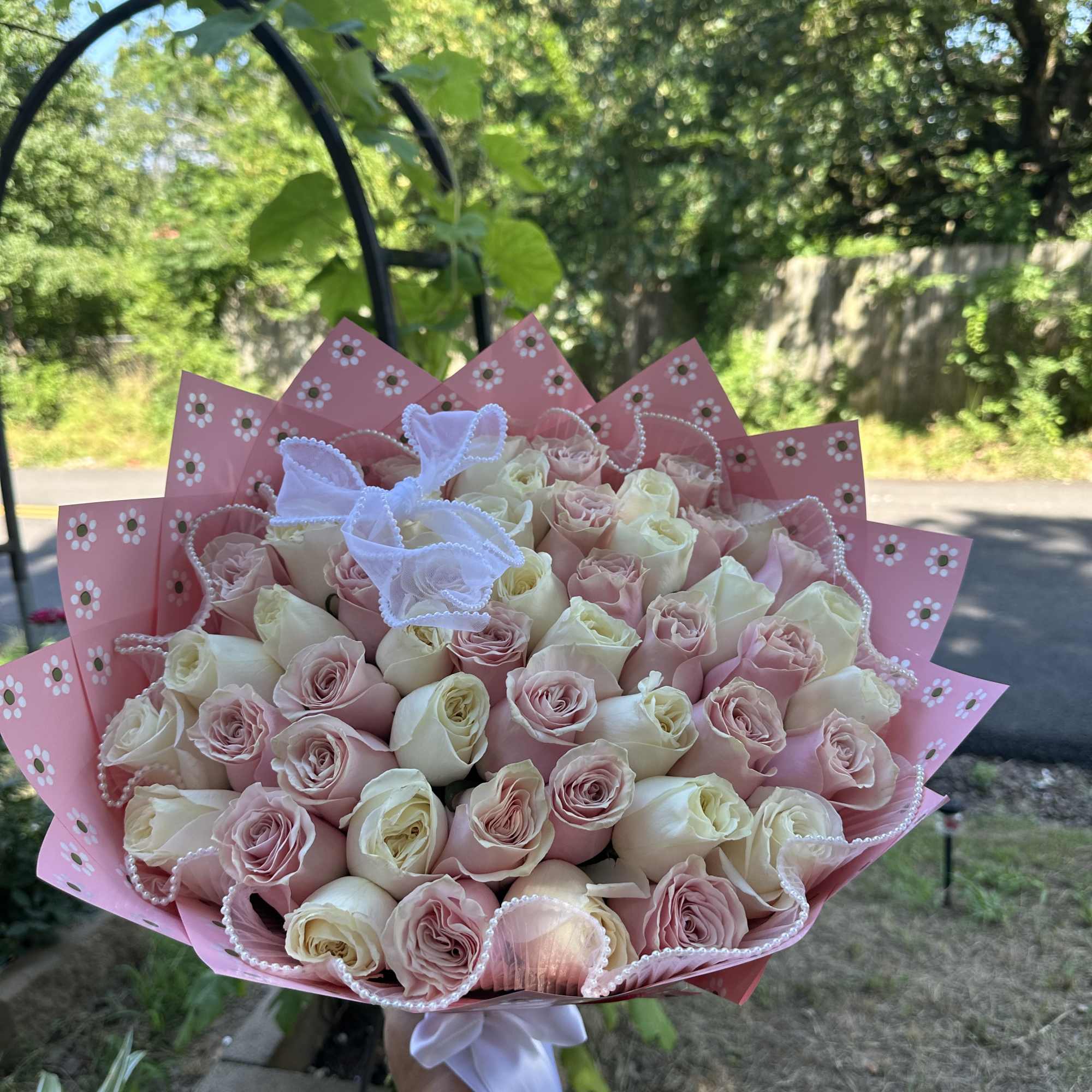  rose wrapped bouquet.

Rose color available:
Red 
Pink
Hot Pink
White

If you want to request