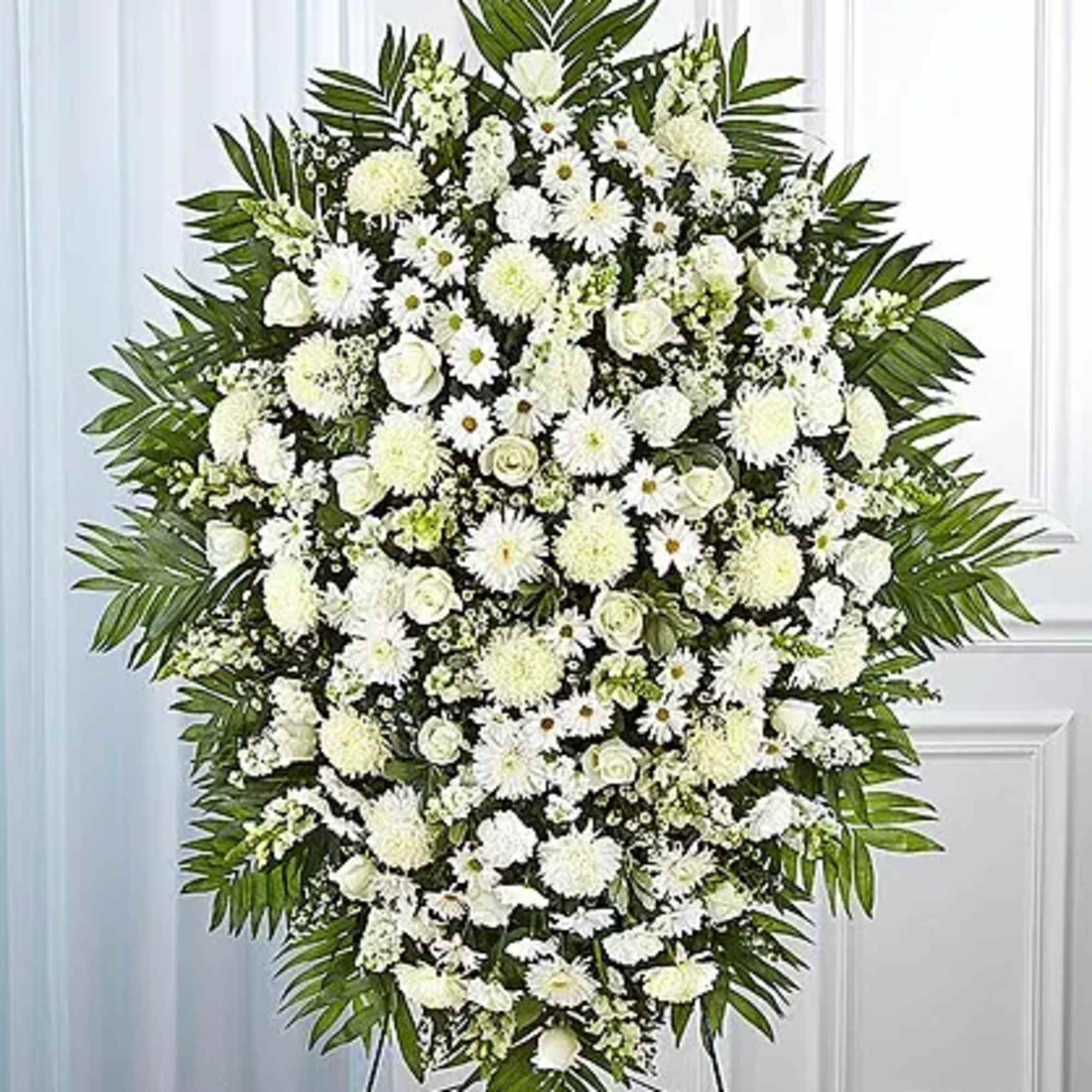 One-sided standing spray arrangement with red carnations, orange Asiatic lilies, yellow Gerbera