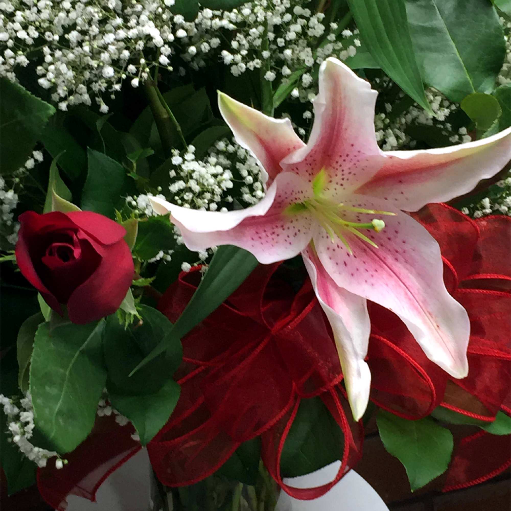 This romantic arrangement of fragrant Pink Stargazer Lilies and luxury Ecuadorian long