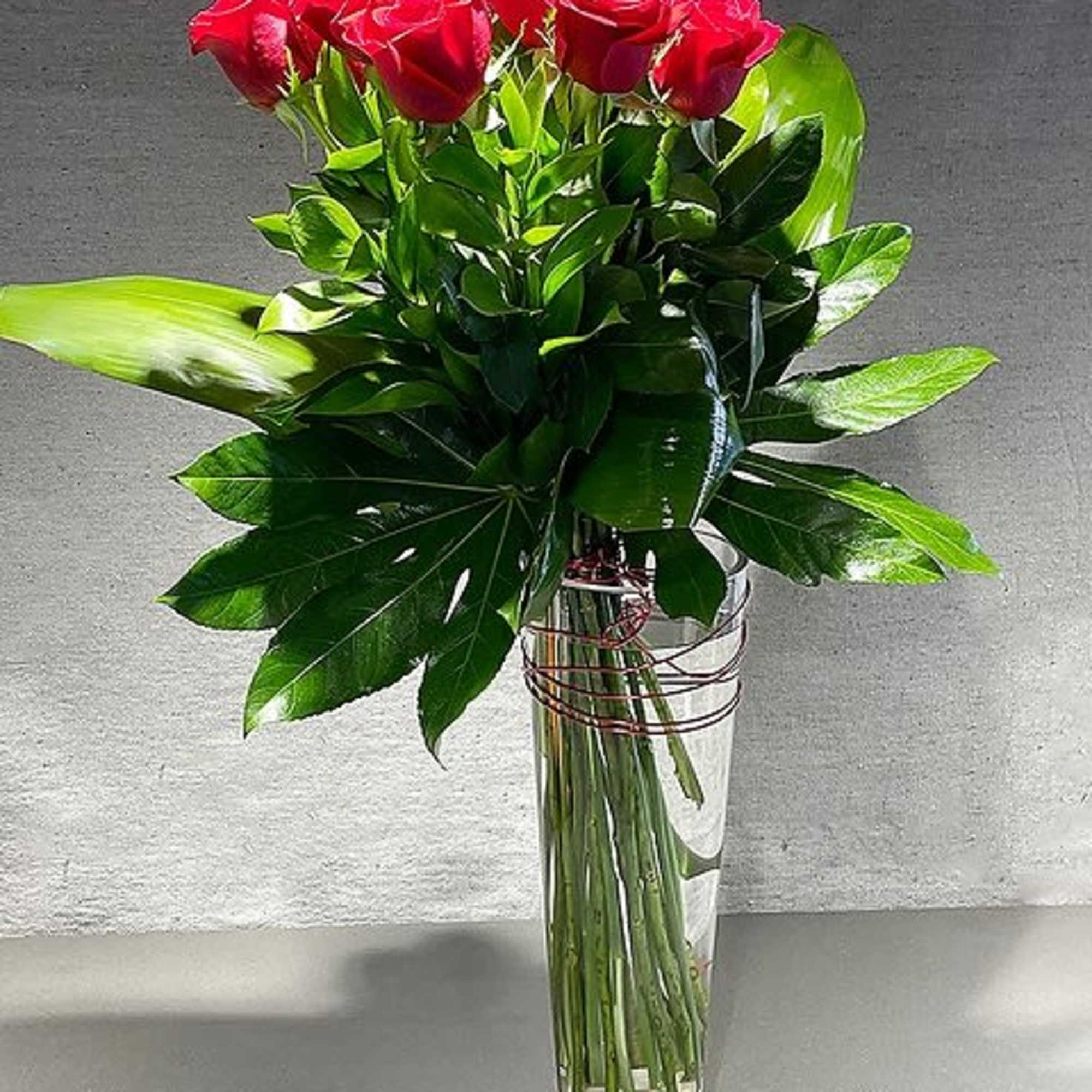 12 or 18 Roses artfully arranged. Why always send the same old