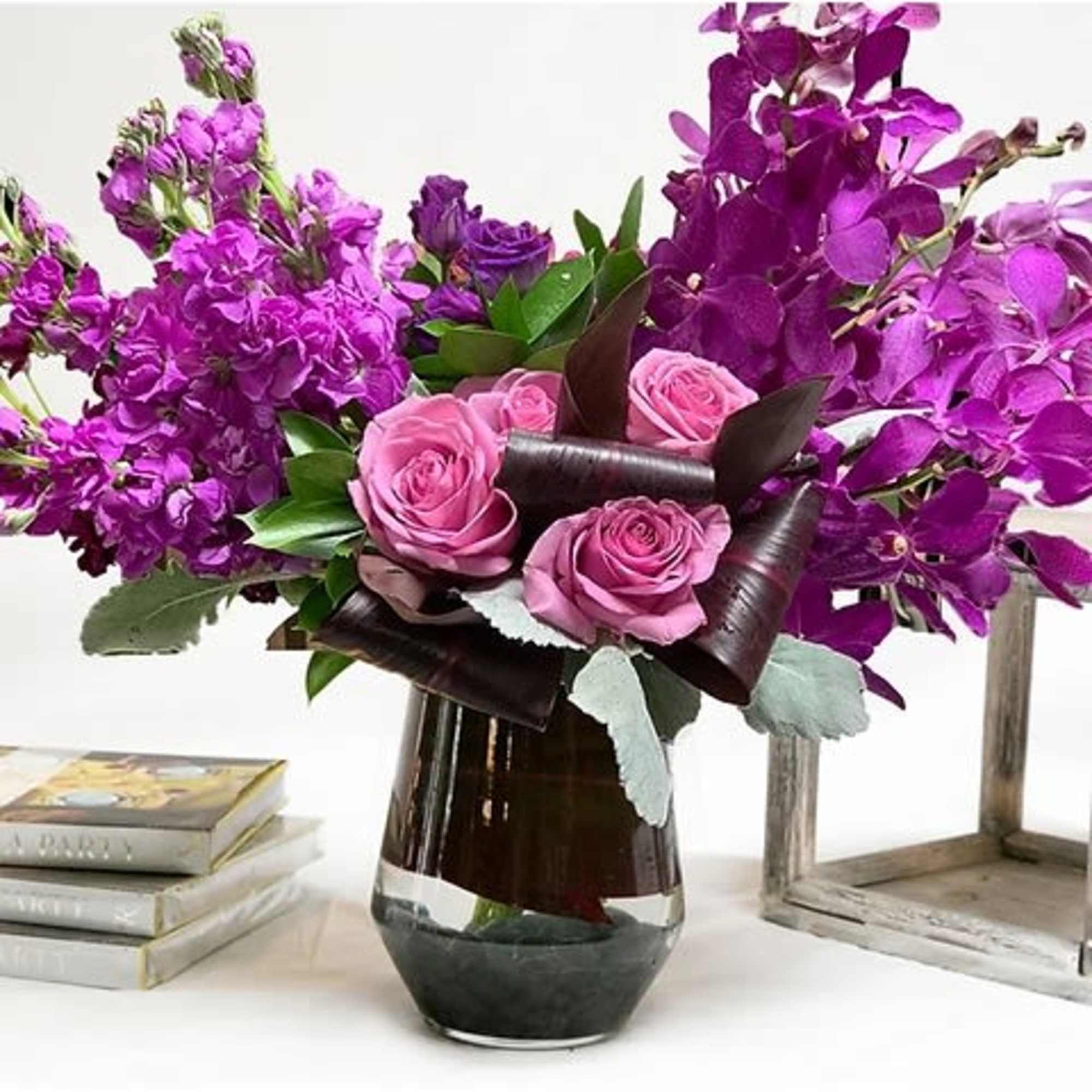 Some colors bring us to another place. This luscious arrangement of orchids