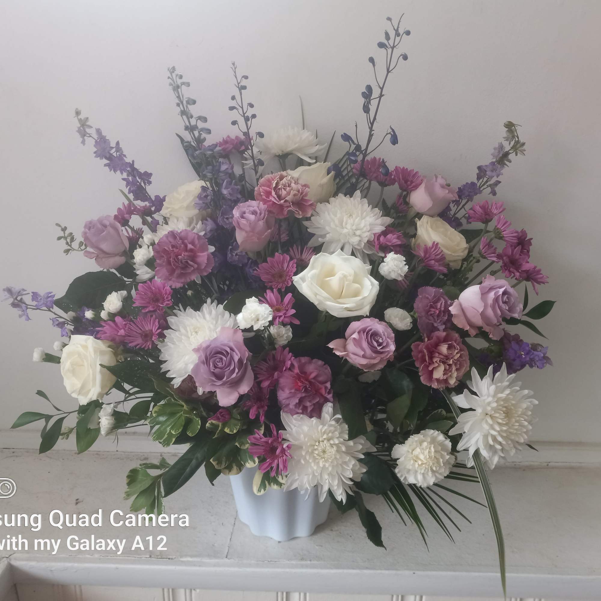 Beautiful purple mist or roses, carnations, daisies, moms and blue delphinium