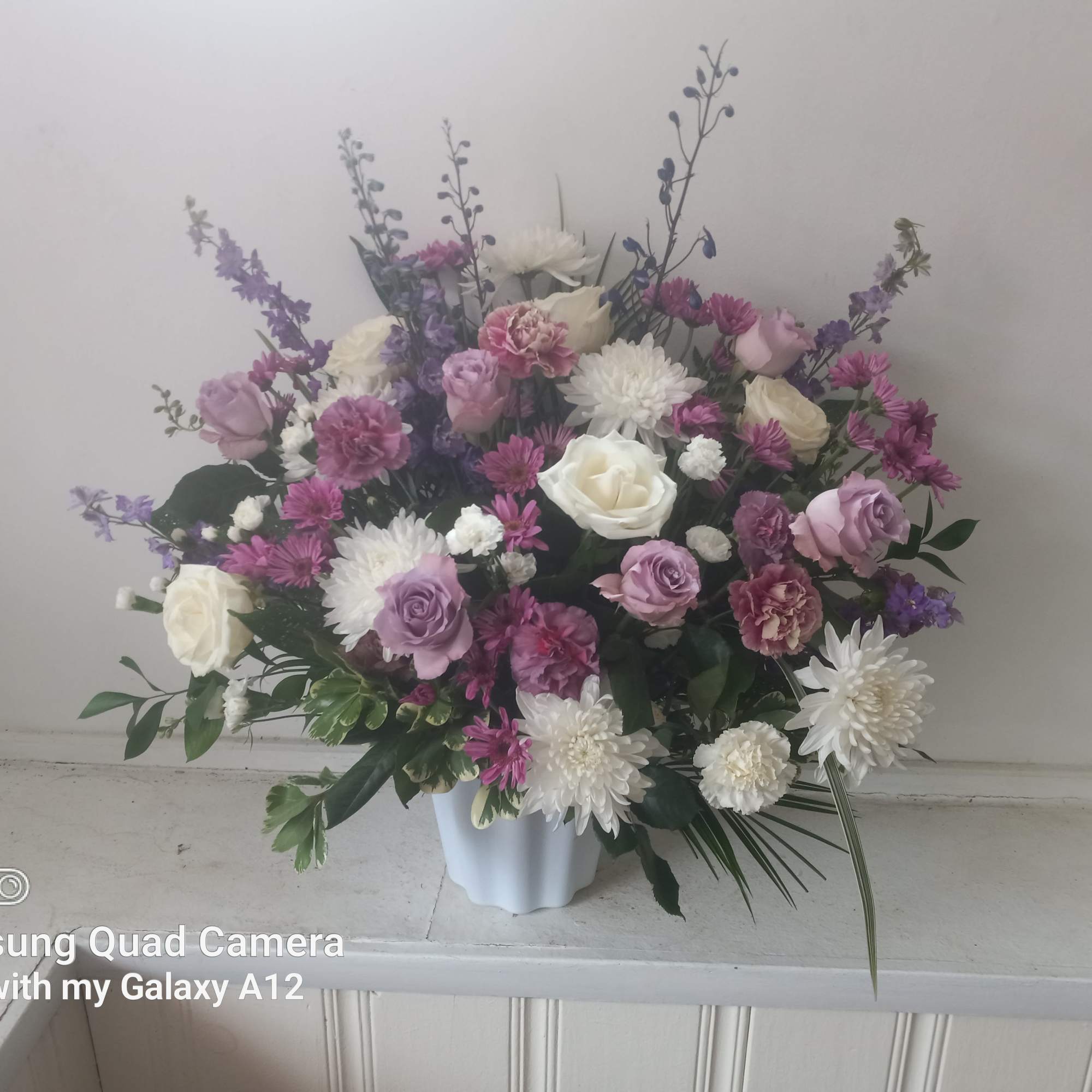 Beautiful purple mist or roses, carnations, daisies, moms and blue delphinium