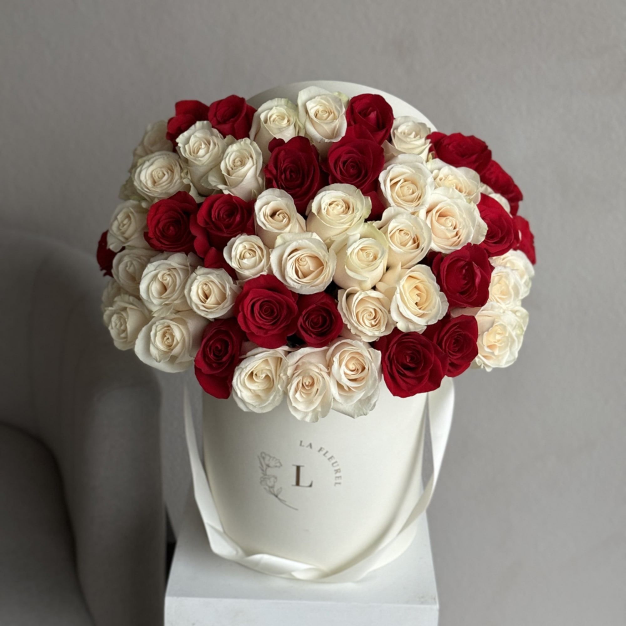 This beautiful arrangement filled with the white and red roses to deliver