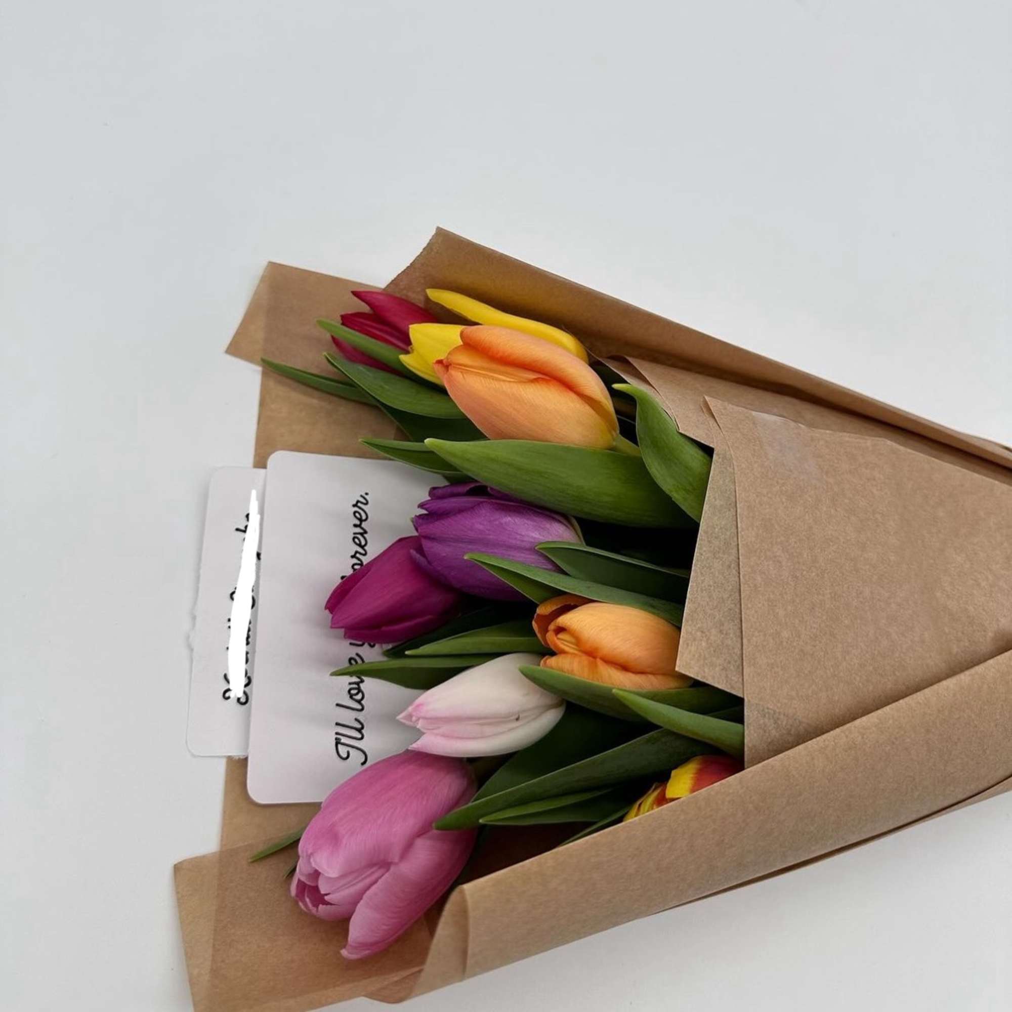 This charming tulip bouquet comes beautifully wrapped. Perfect for surprising a loved