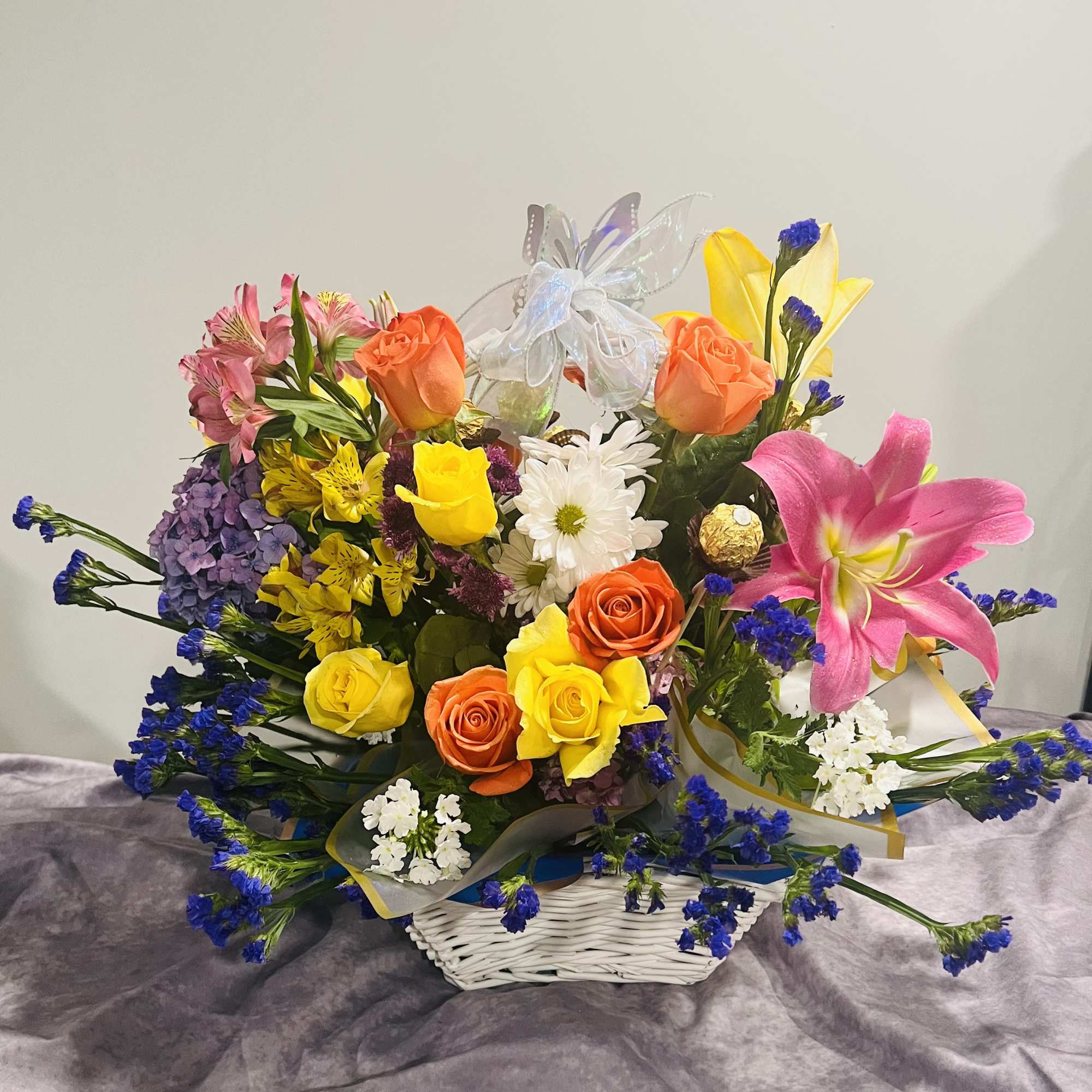 Large Basket of varieties color of flowers combined with FERRERO ROCHER give Large Basket of varieties color of flowers combined with FERRERO ROCHER give