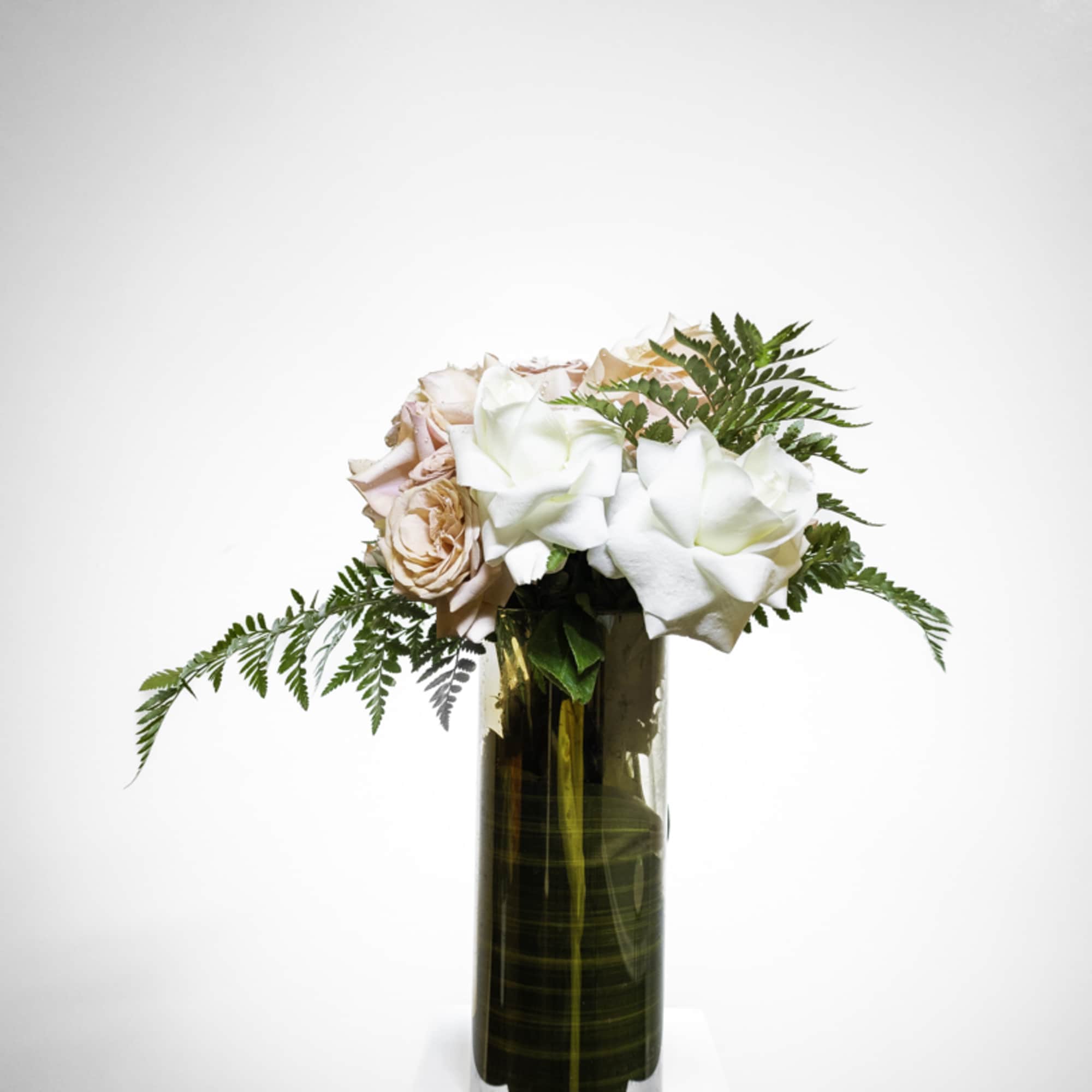 Hand flex roses combined with Capaccino roses embedded with baker fern.