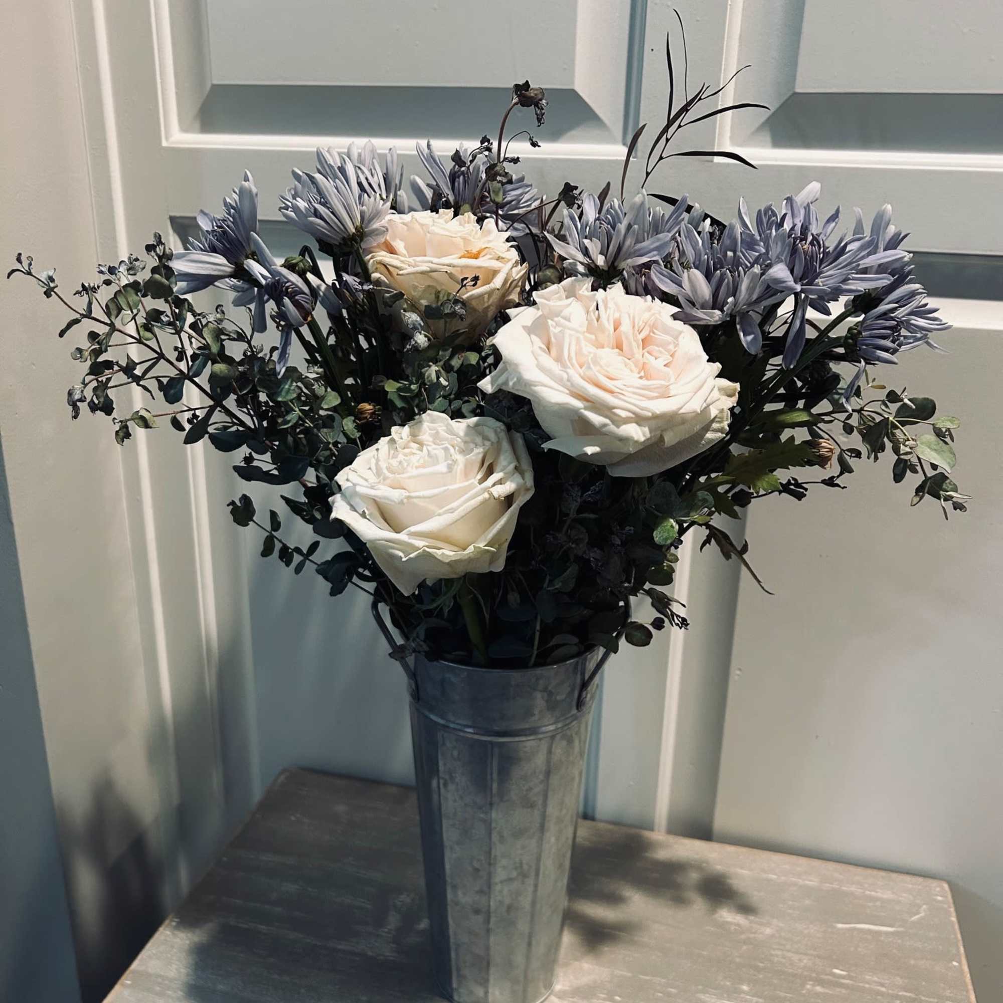 A darling bouquet of the freshest cut roses and assorted foliage. Delicately A darling bouquet of the freshest cut roses and assorted foliage. Delicately