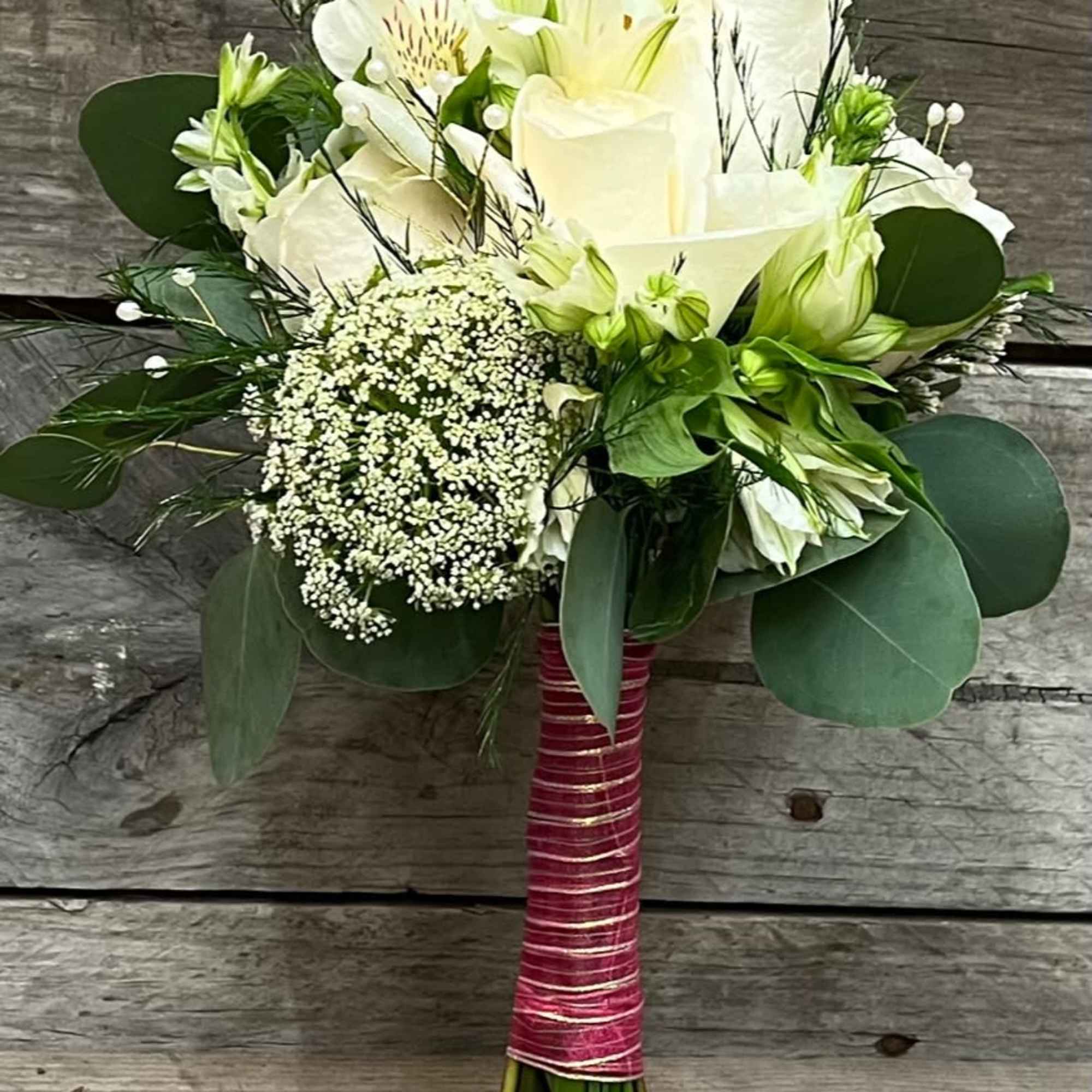 Mix of all white flowers arranged beautifully in small handheld handpicked look
