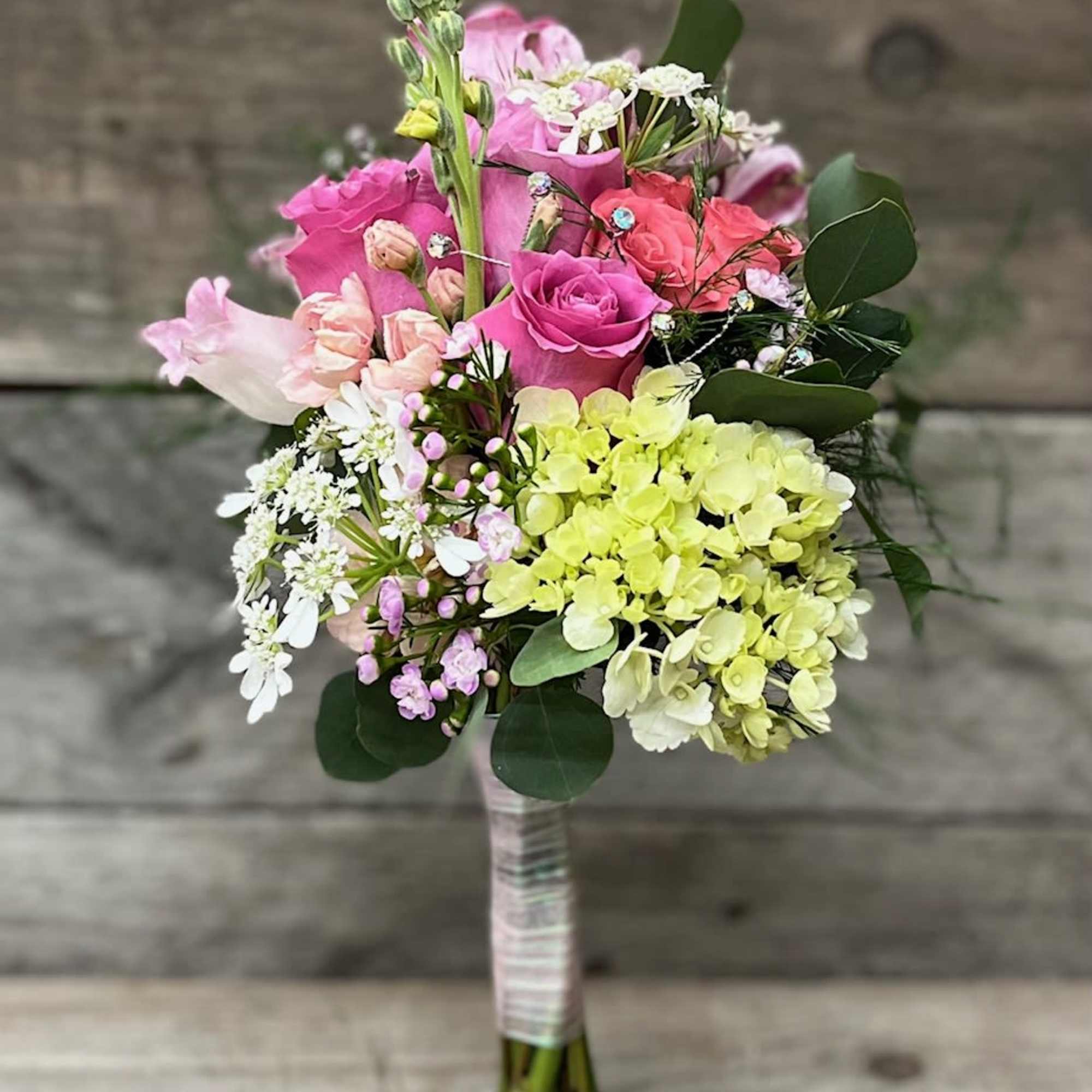 Mix of all white &amp; pink flowers arranged beautifully in small handheld