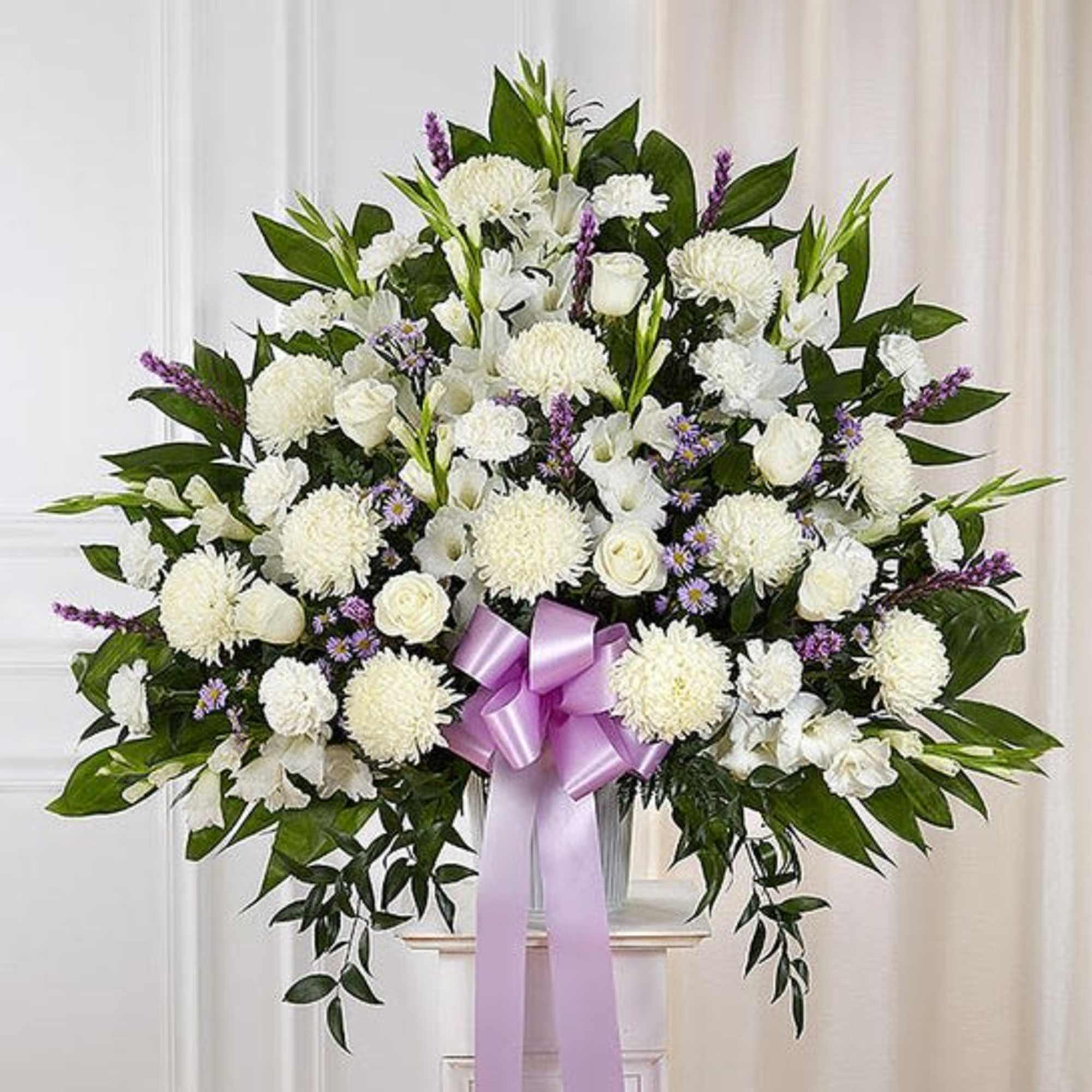 Standing basket arrangement with white roses, football mums, stock and carnations; lavender