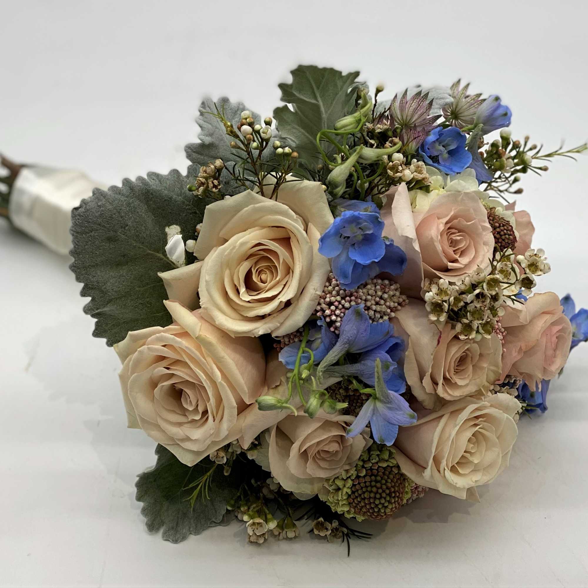 The dusty coloring of this bouquet with the touch of pale blue The dusty coloring of this bouquet with the touch of pale blue