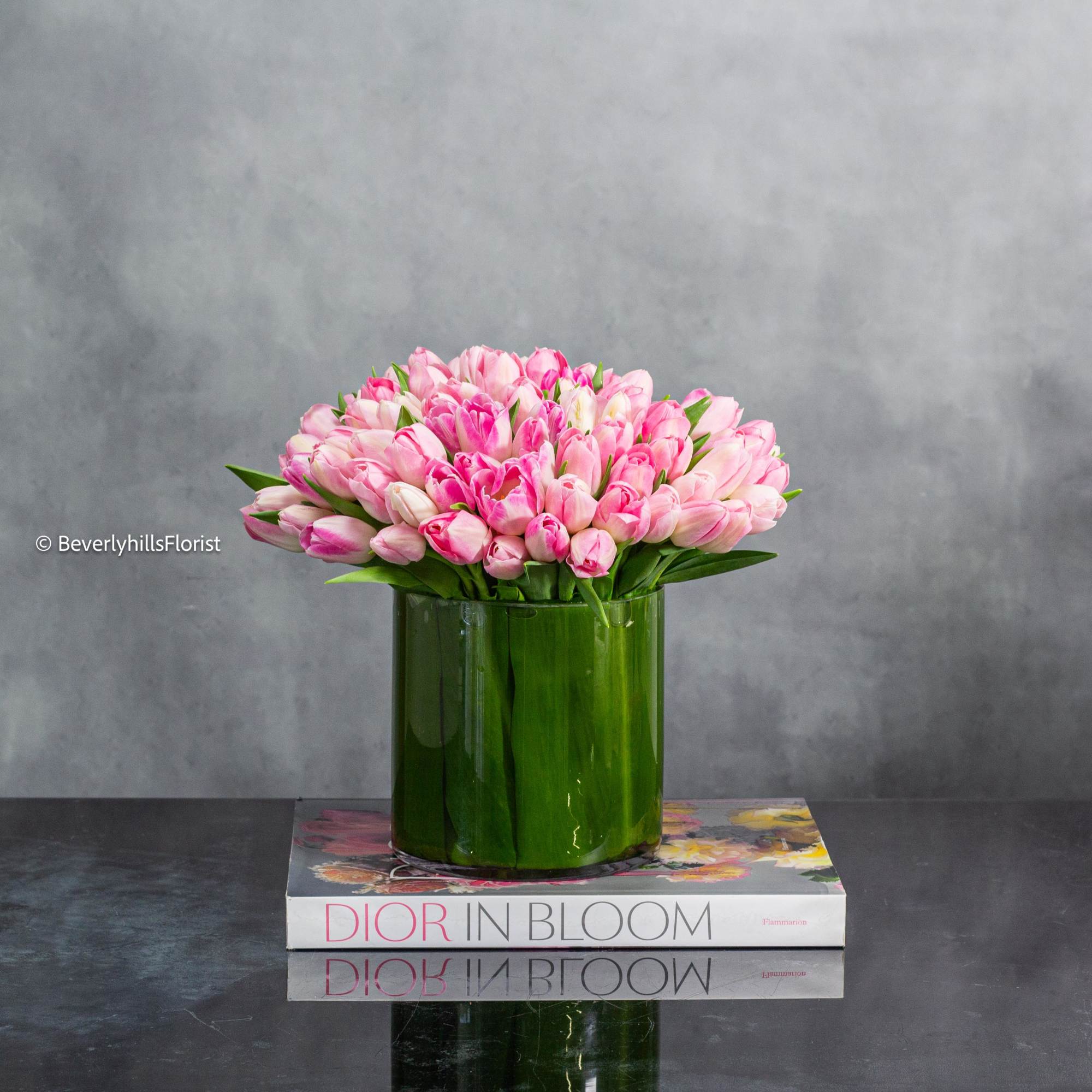 In a clear cylinder glass vase, a simple yet enchanting display unfolds. In a clear cylinder glass vase, a simple yet enchanting display unfolds.