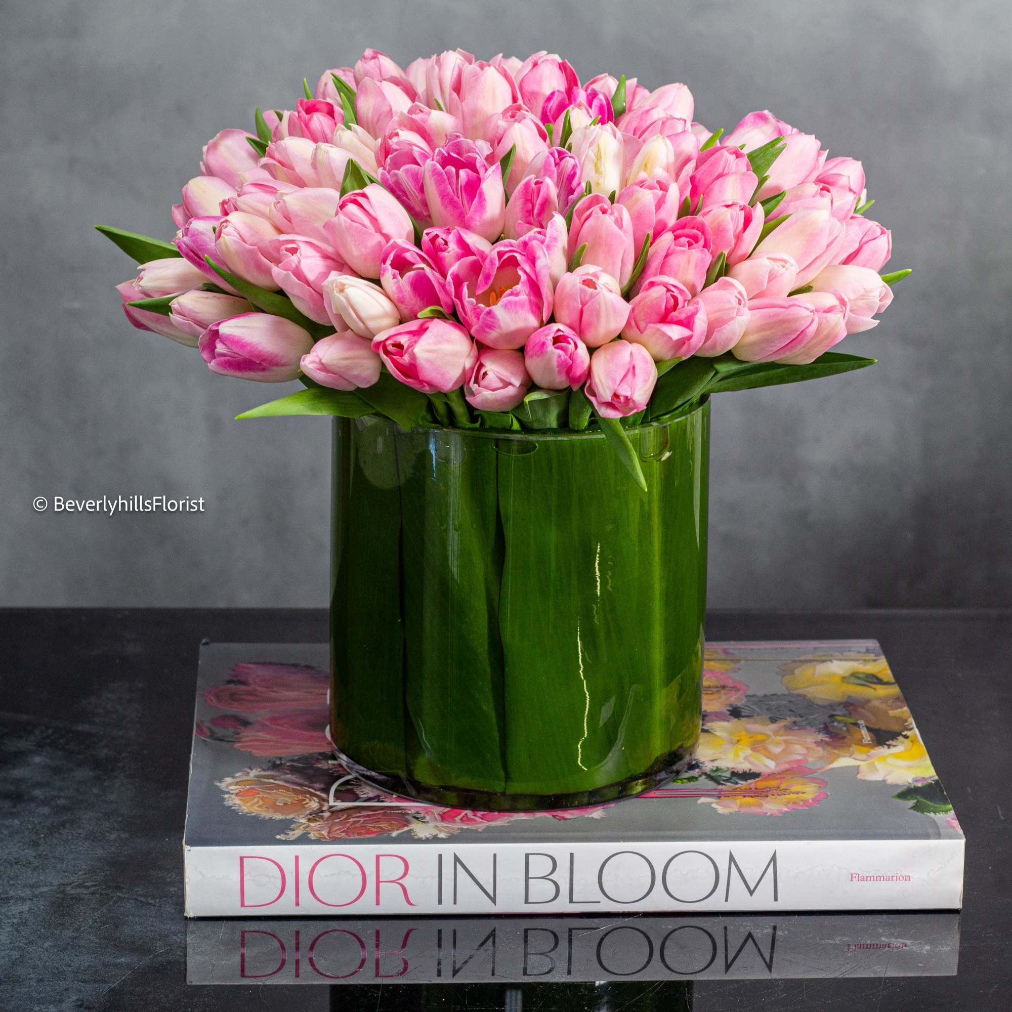 In a clear cylinder glass vase, a simple yet enchanting display unfolds. In a clear cylinder glass vase, a simple yet enchanting display unfolds.