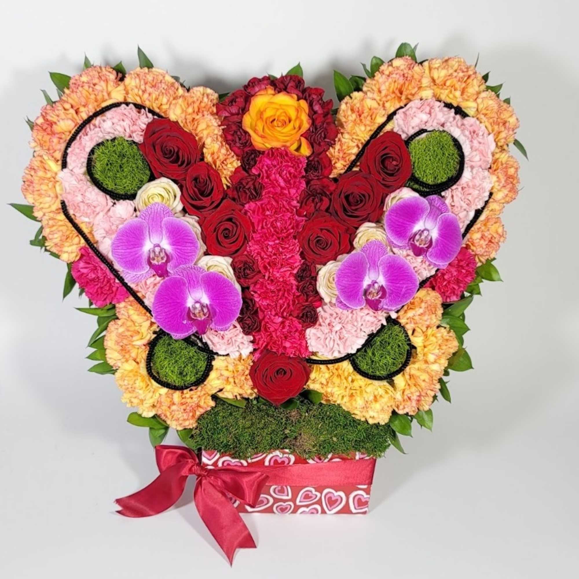 A Natural butterfly arrangement made of different flowers such as roses, bottoms A Natural butterfly arrangement made of different flowers such as roses, bottoms