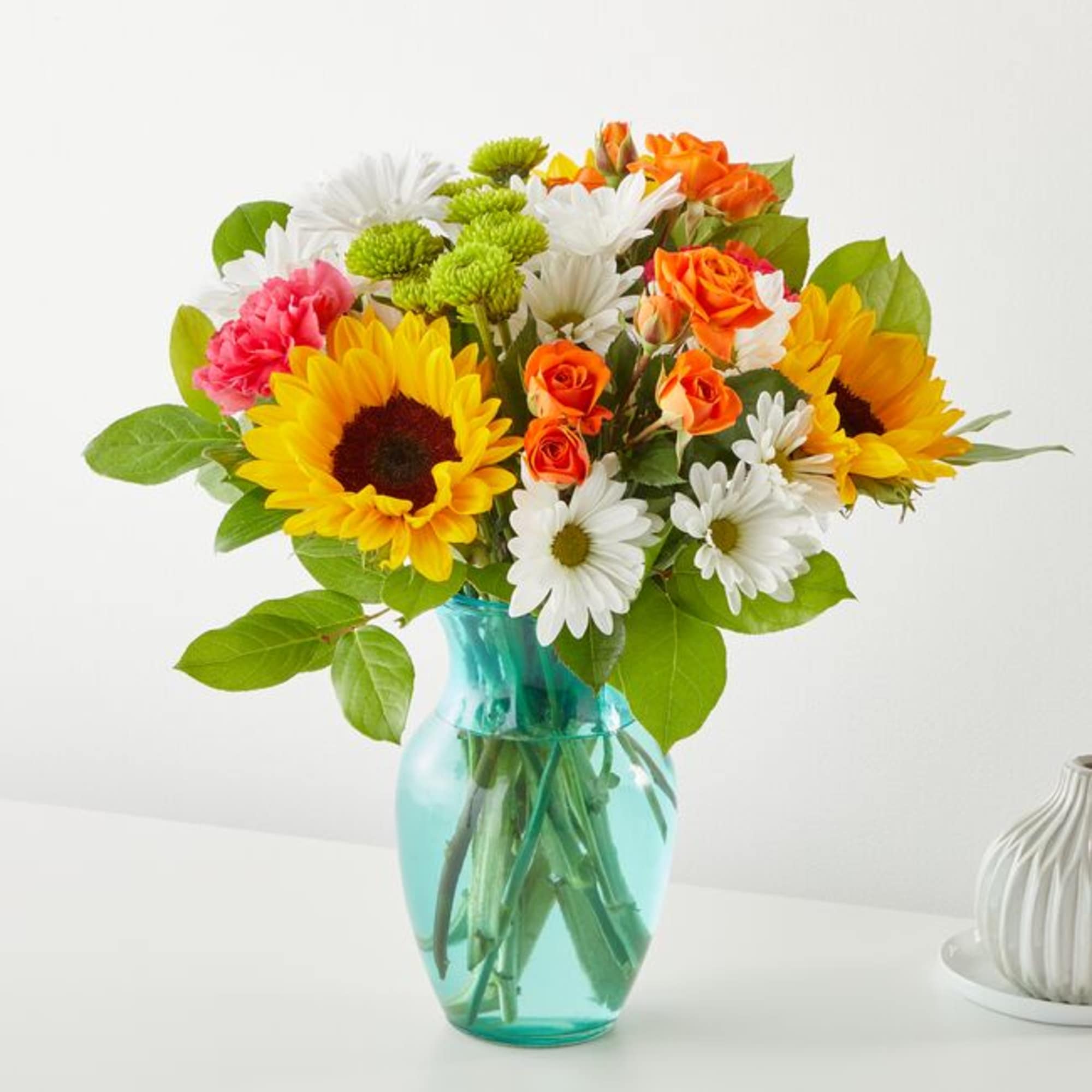 Welcome warmer weather with the Sun-Drenched Blooms Bouquet! Sunflowers, hot pink carnations