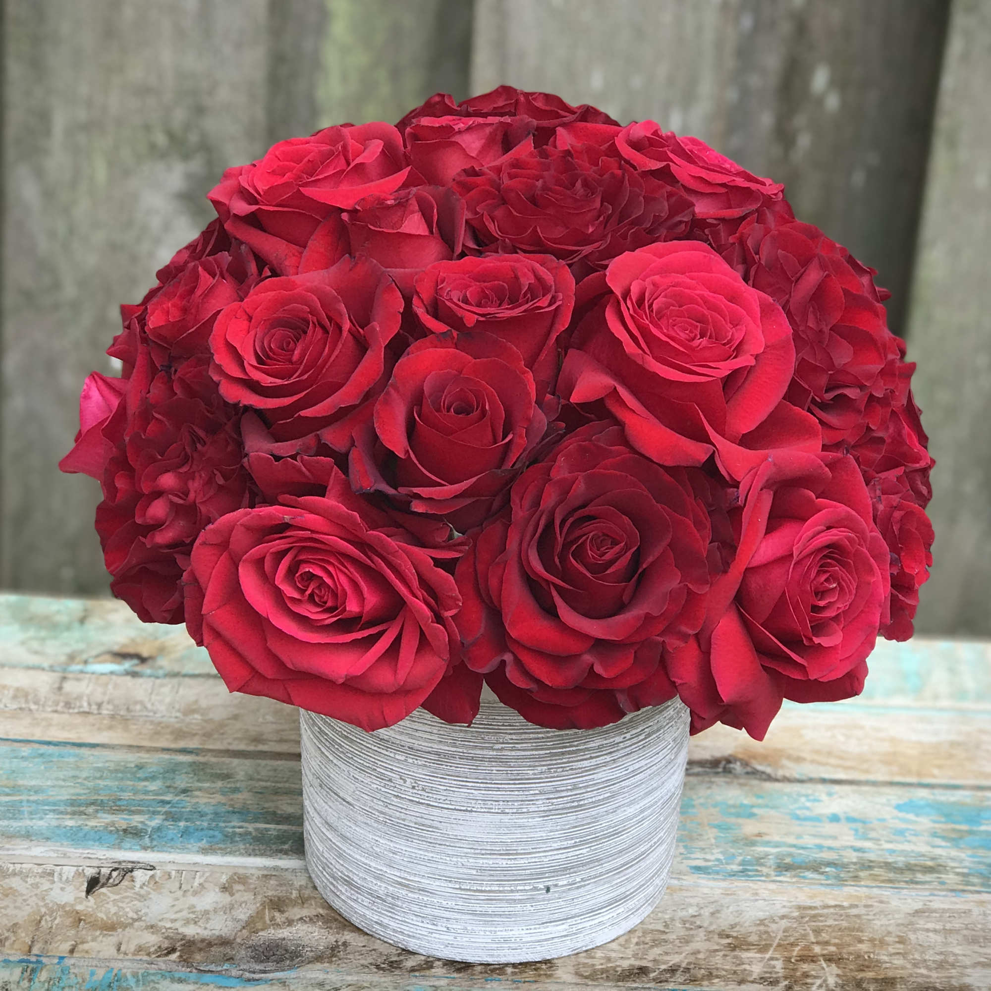 2 dozen of our freshest red roses gathered close for a glamorous