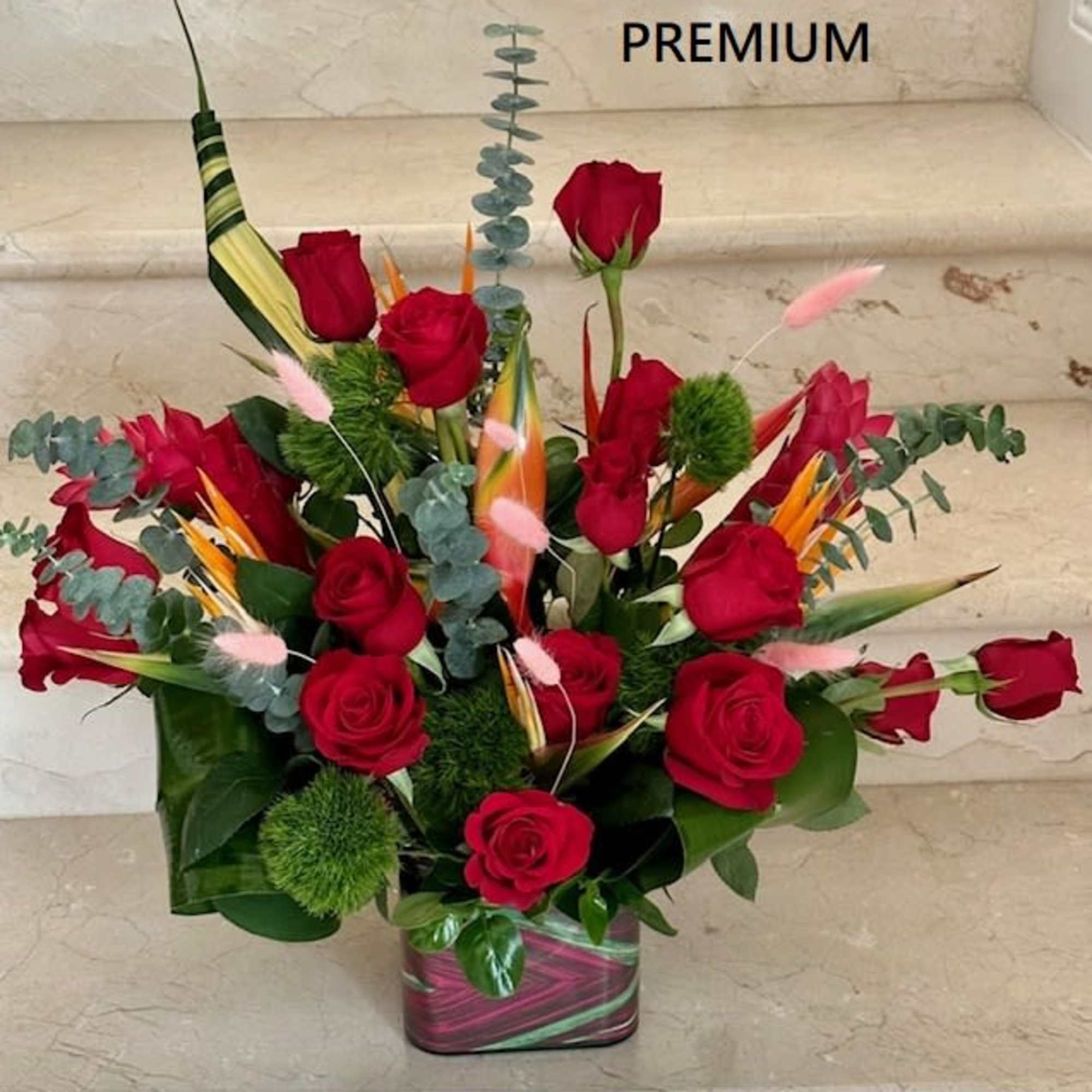 Red Roses and Tropical flowers with Birds of Paradise and Red Gingers.