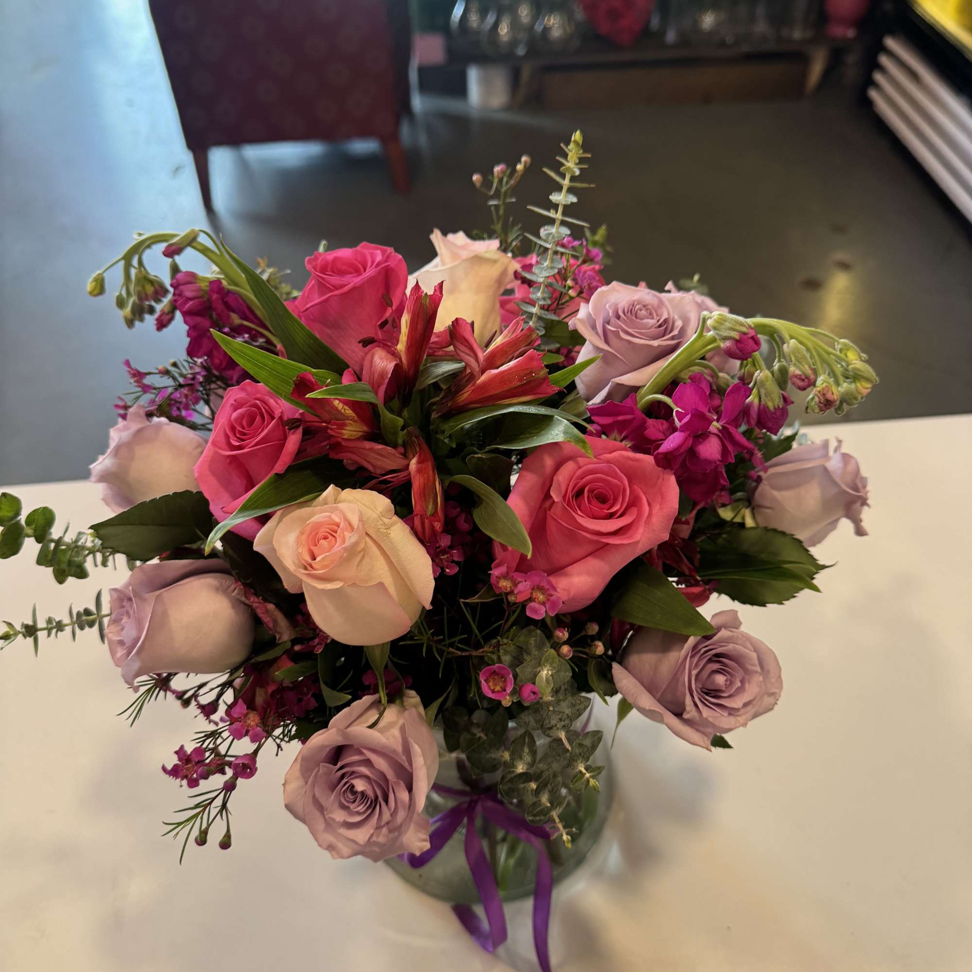 12 *13 inch vase height filled with roses, carnations, eucalyptus, stocks, Alstromerias