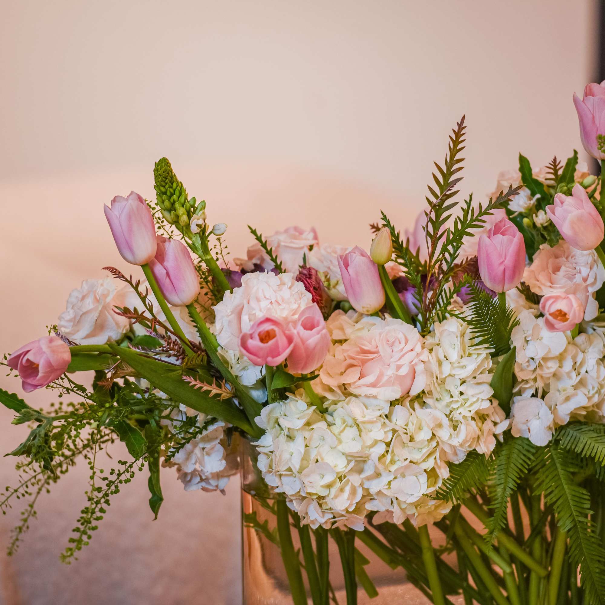 Delight in the enchanting beauty of our Floral Harmony arrangement, gracefully showcased Delight in the enchanting beauty of our Floral Harmony arrangement, gracefully showcased