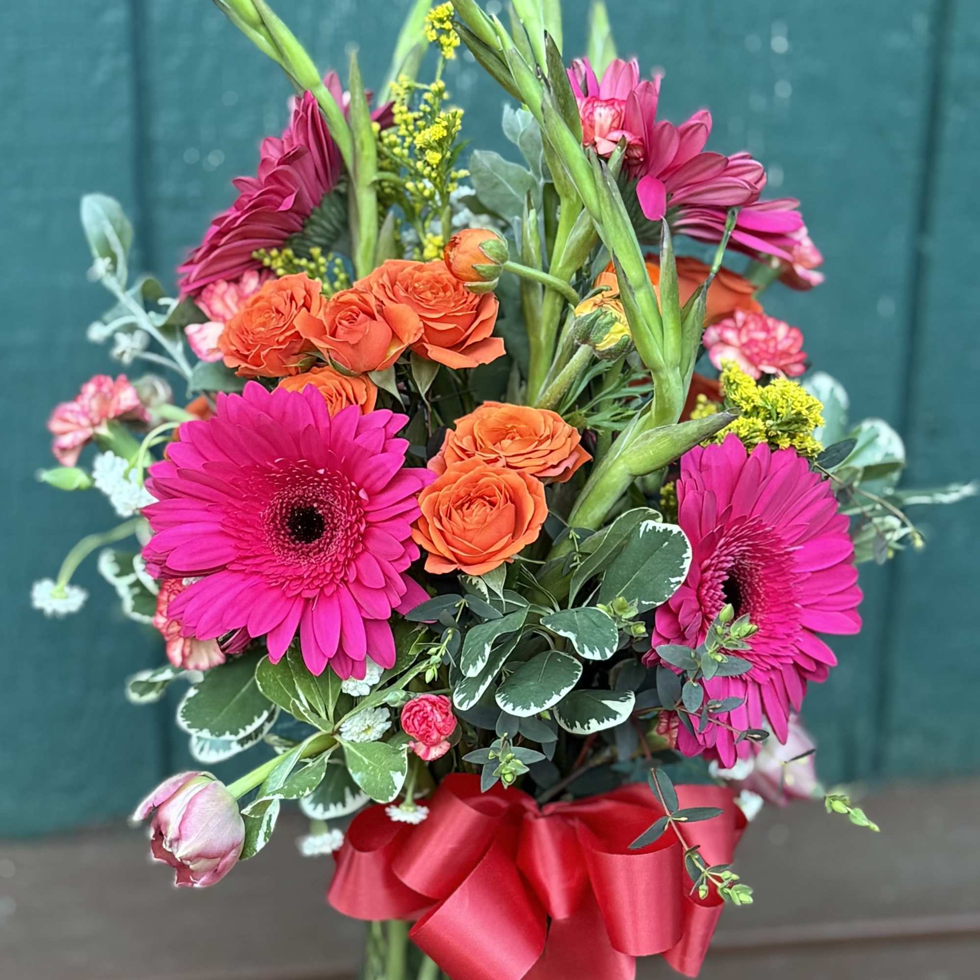 This radiant arrangement is inspired by the quiet strength and joy within.