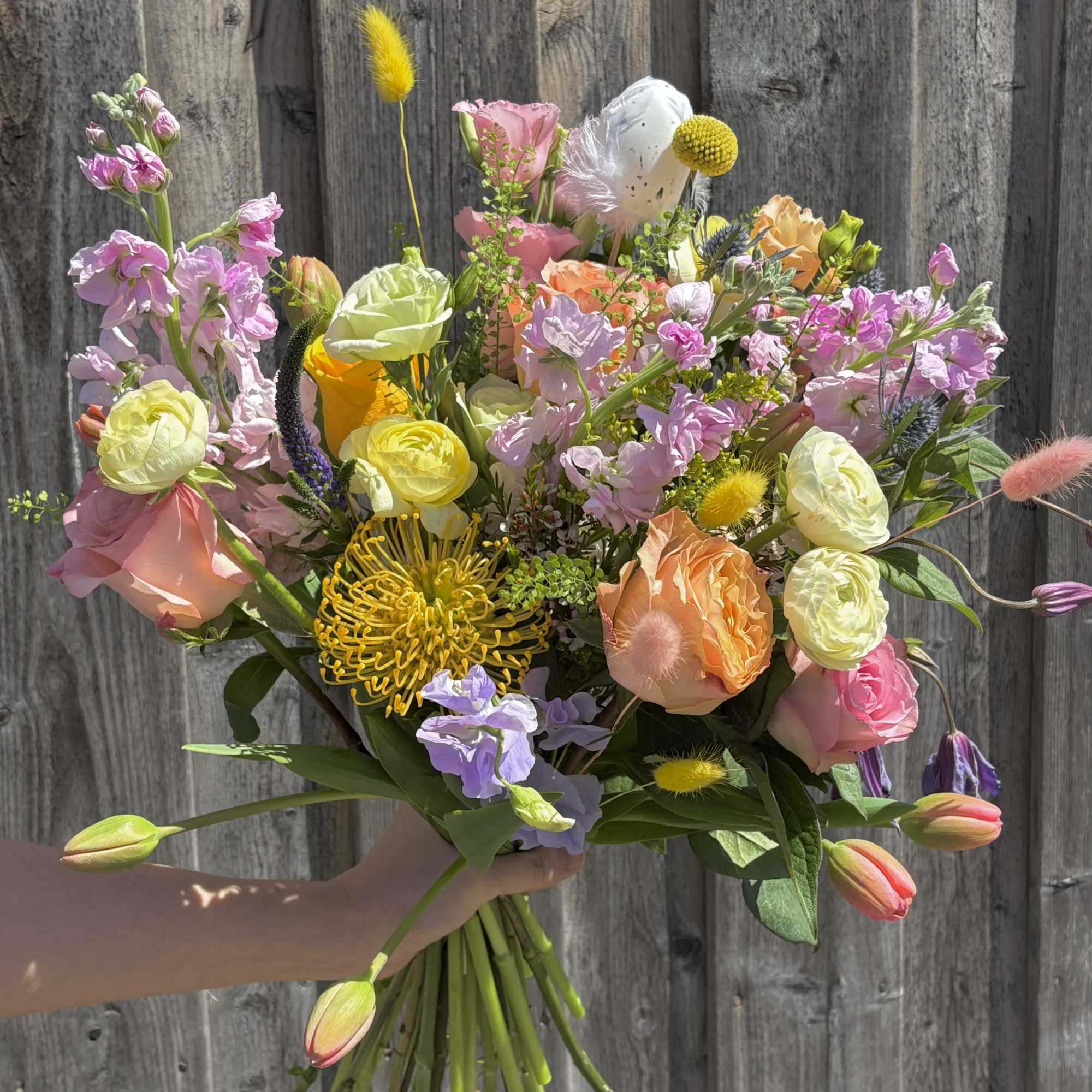 A joyful mix of pastel blooms in a fun, spring-inspired bouquet. 