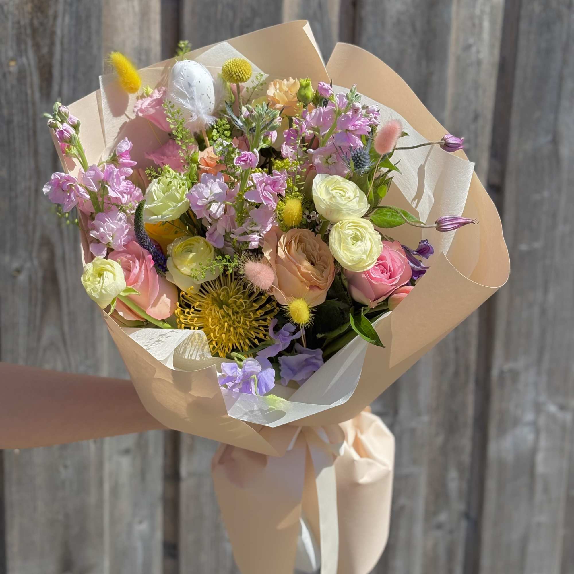 A joyful mix of pastel blooms in a fun, spring-inspired bouquet. 