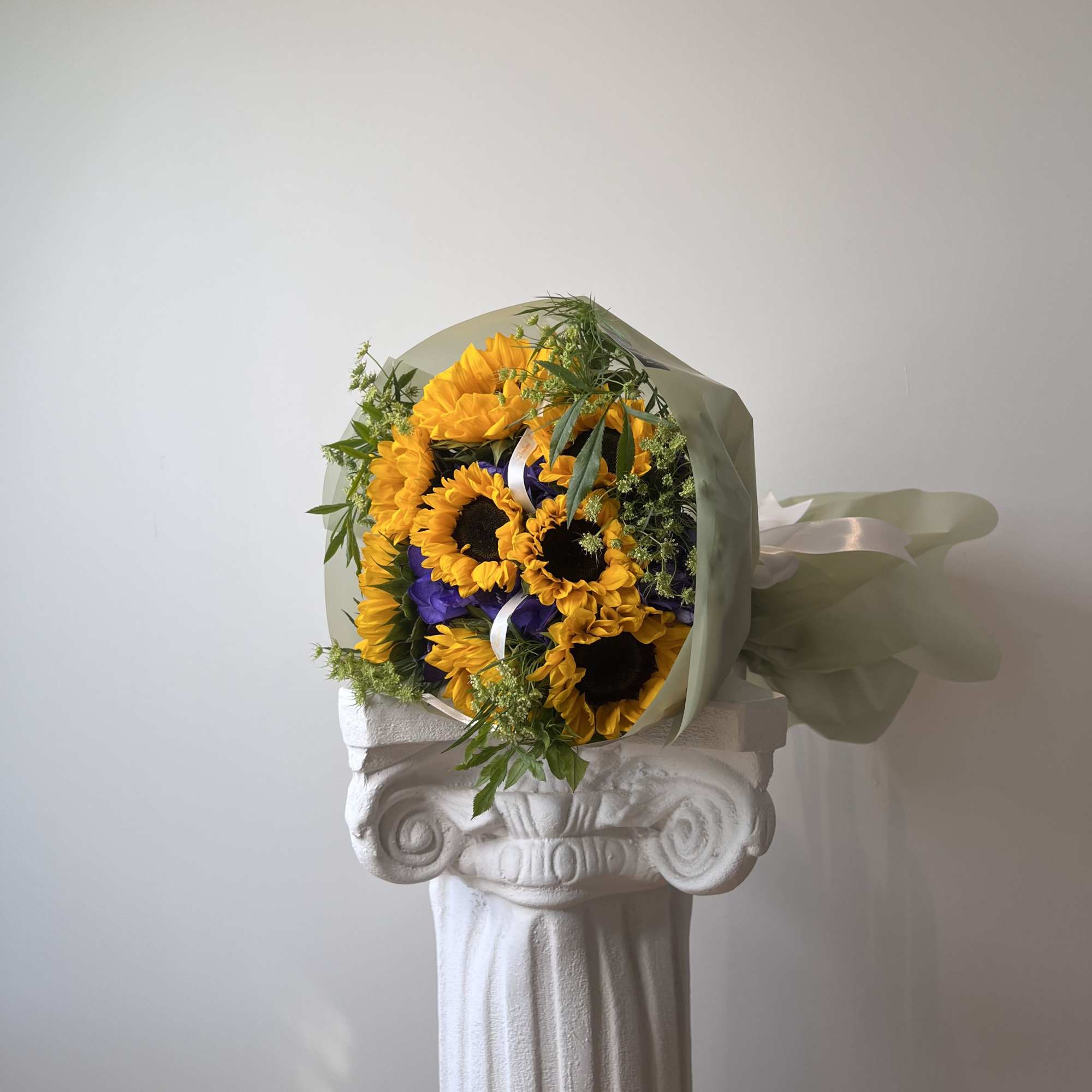 The beauty of sunflowers meets the elegance of purple hydrangeas, creating a