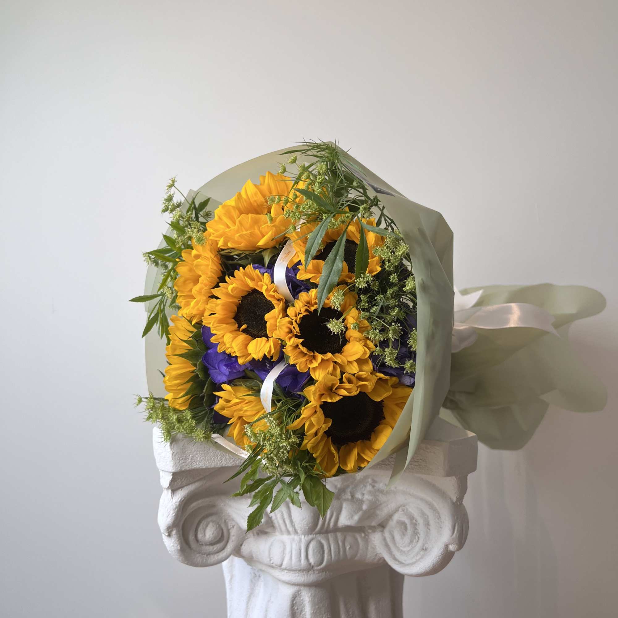 The beauty of sunflowers meets the elegance of purple hydrangeas, creating a