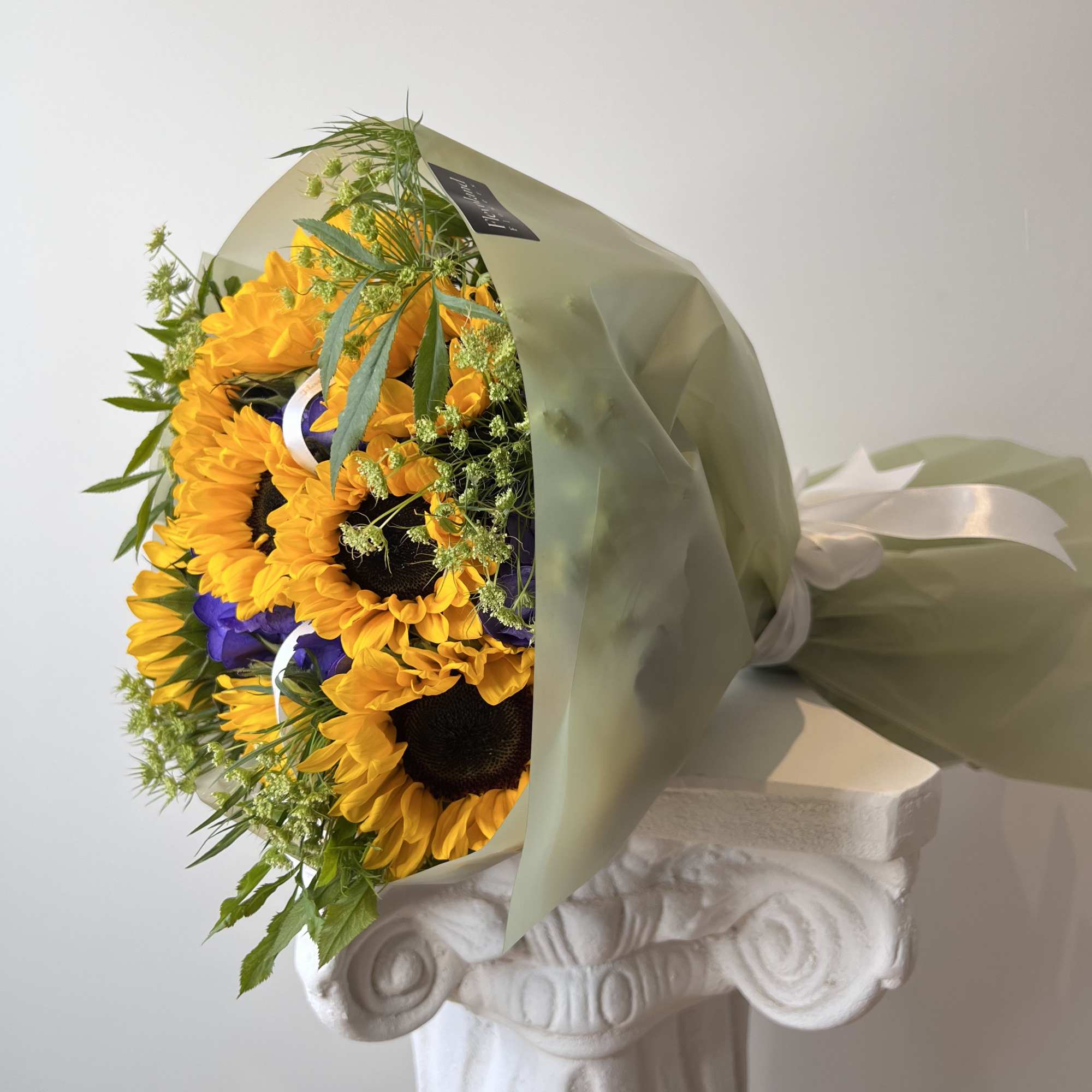 The beauty of sunflowers meets the elegance of purple hydrangeas, creating a