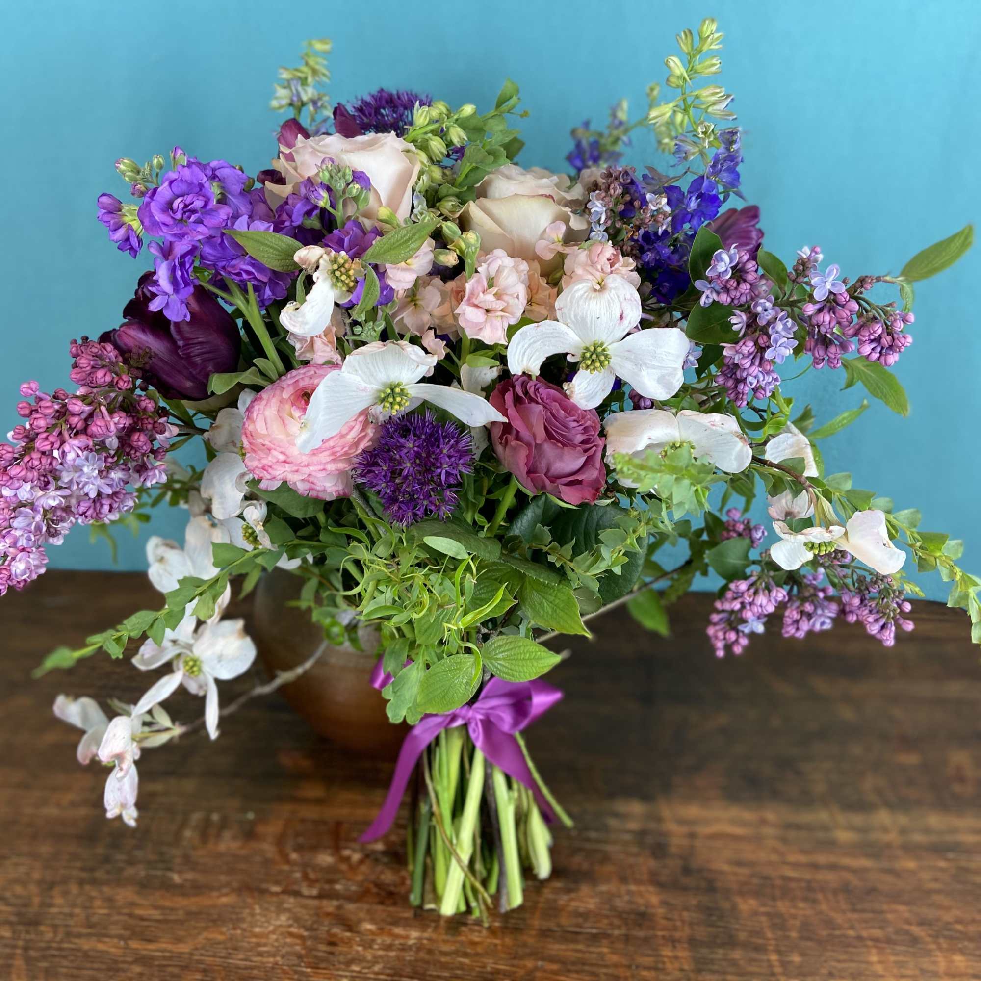 Bouquet of seasonal blooms, ready to drop into any vase. Bouquet is