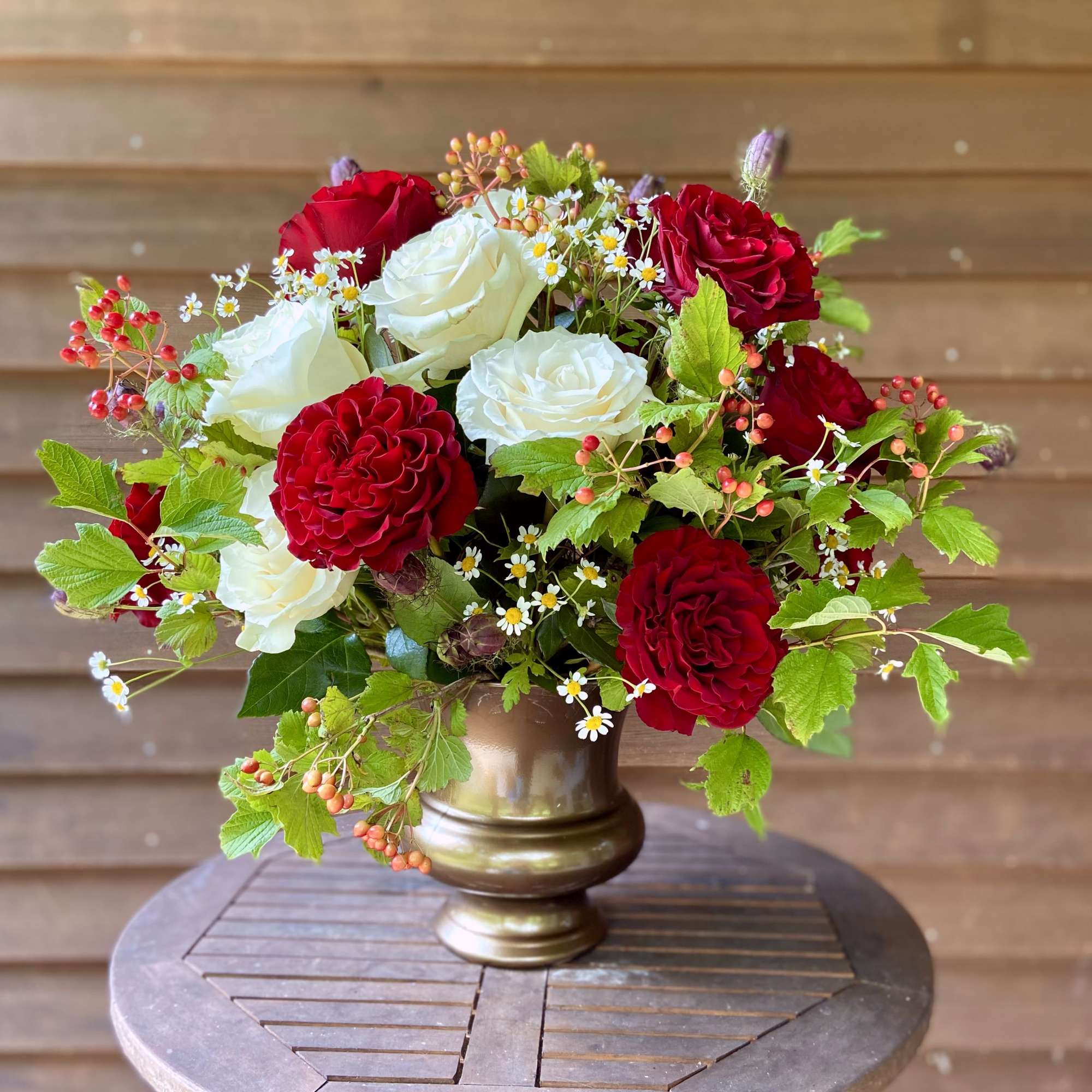 Our rose arrangements are a step above the rest, including interesting greenery