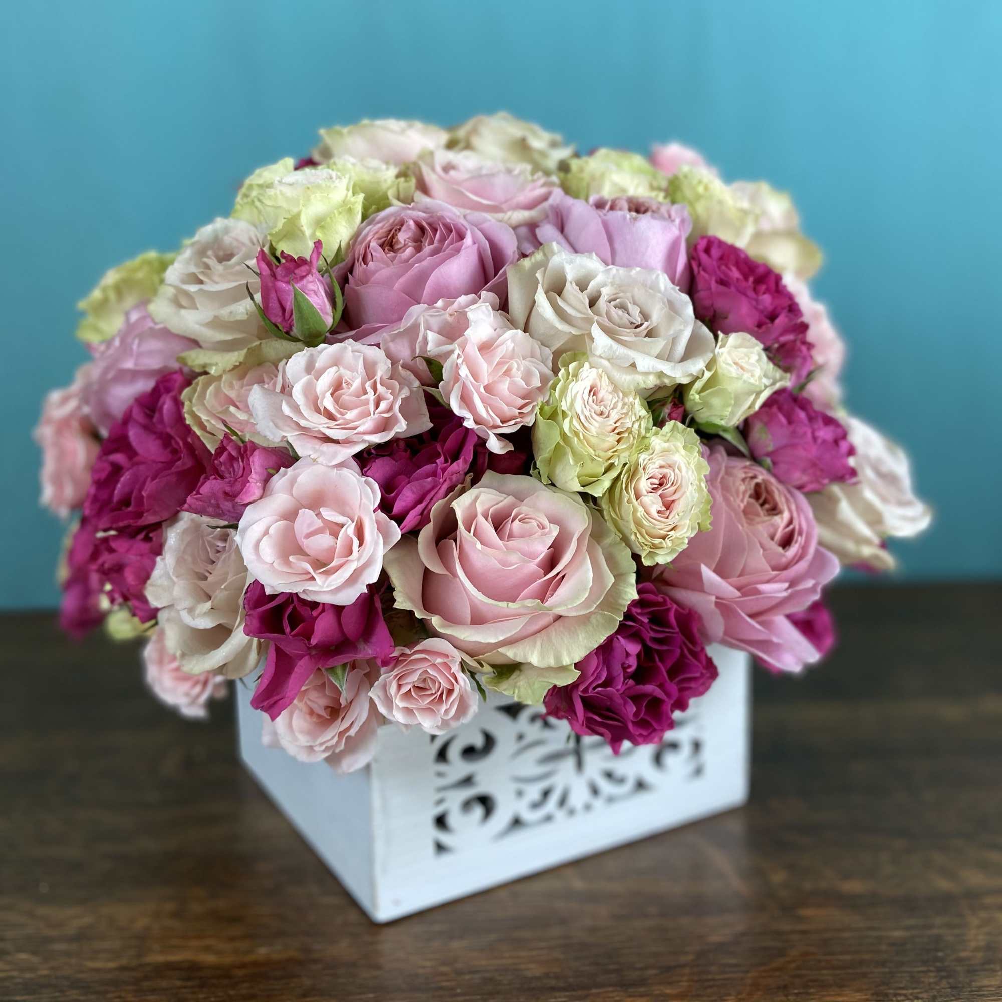 Our rose arrangements are a step above the rest, including interesting greenery