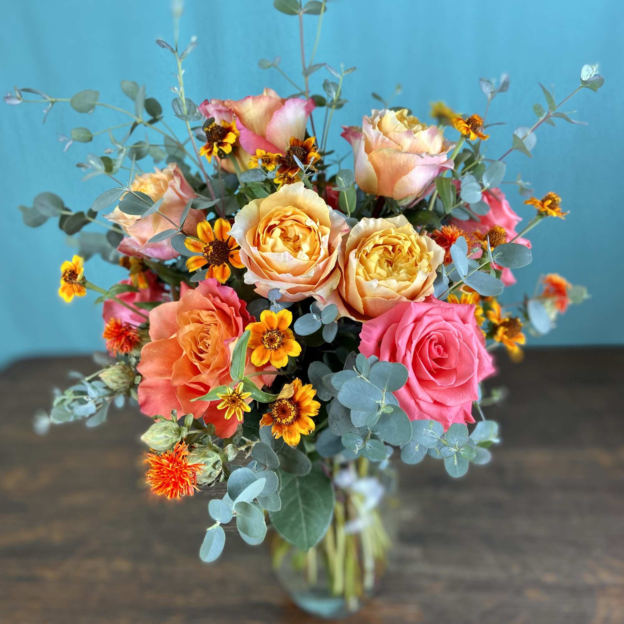 Our rose arrangements are a step above the rest, including interesting greenery