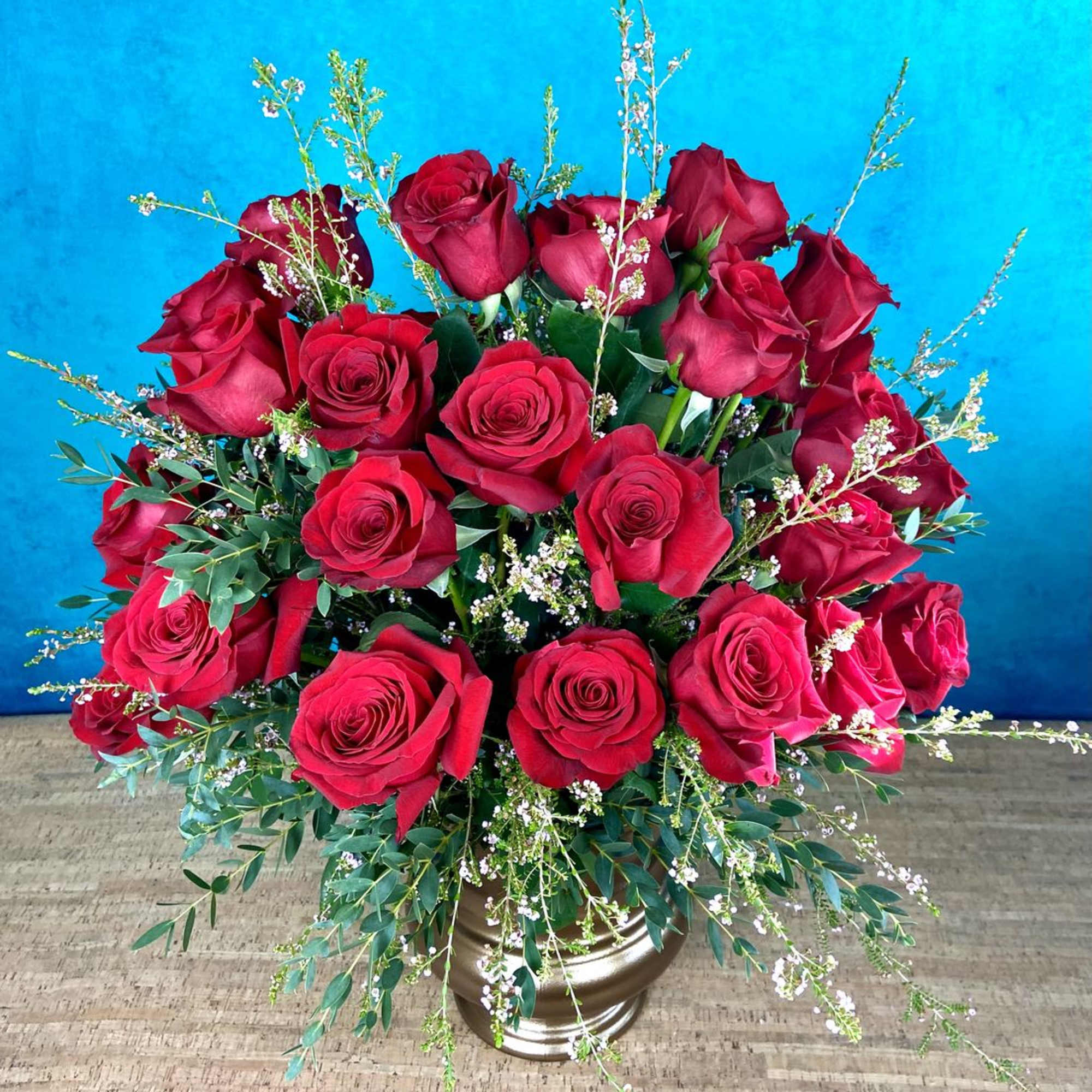 Our rose arrangements are a step above the rest, including interesting greenery