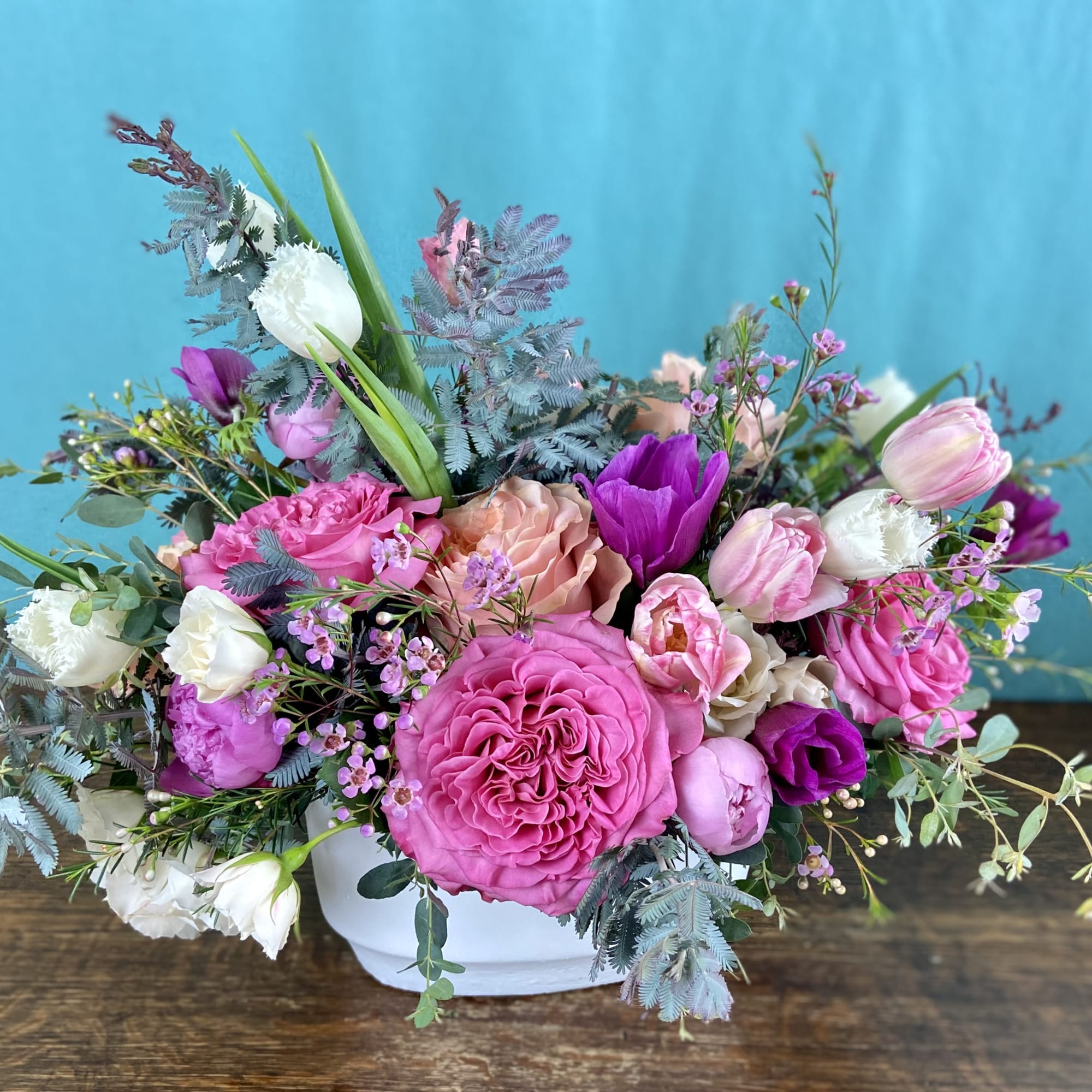 Romantic explosion of premium blooms like garden roses, double tulips, honeysuckle in