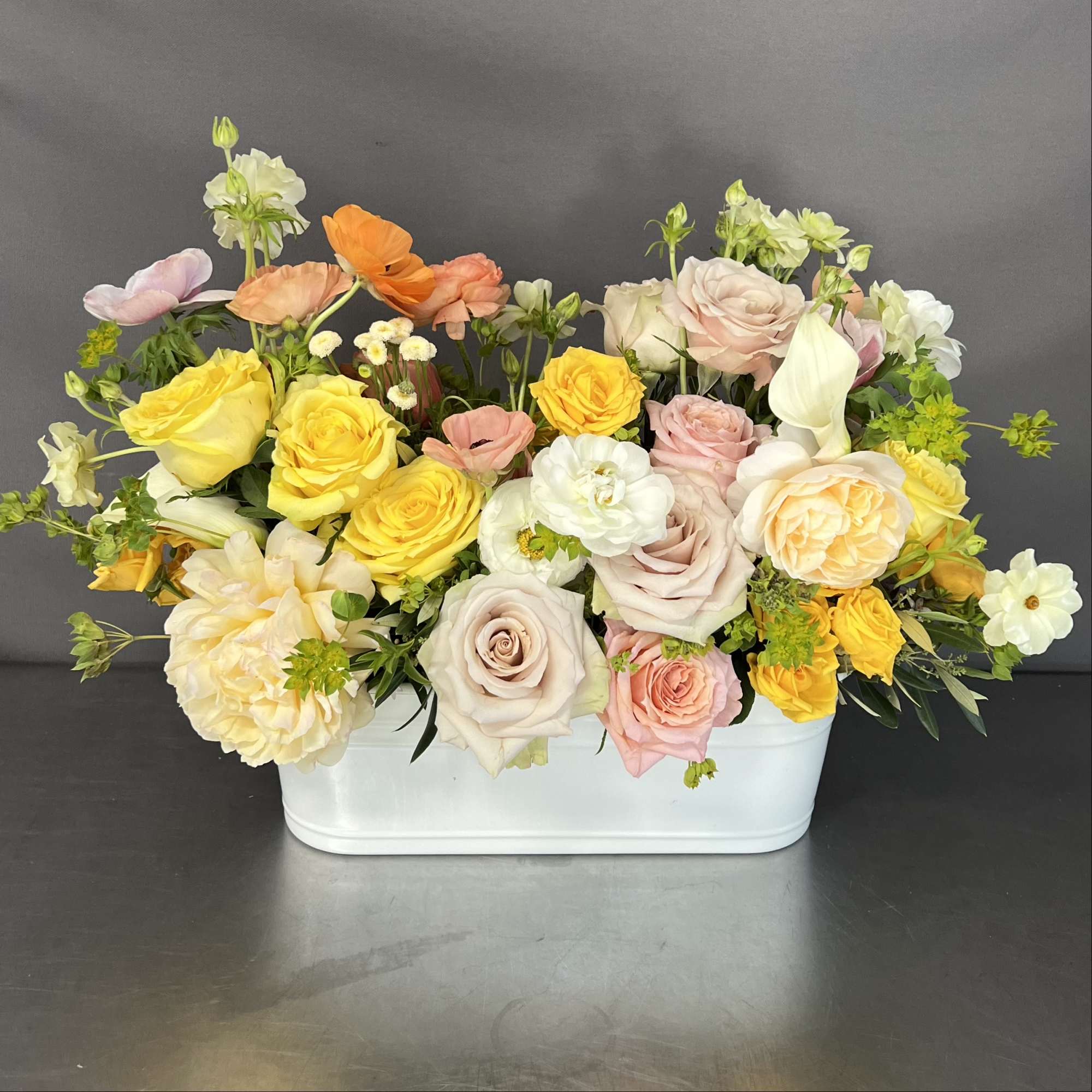 This beautiful floral arrangement is a showstopper. This design is arranged with