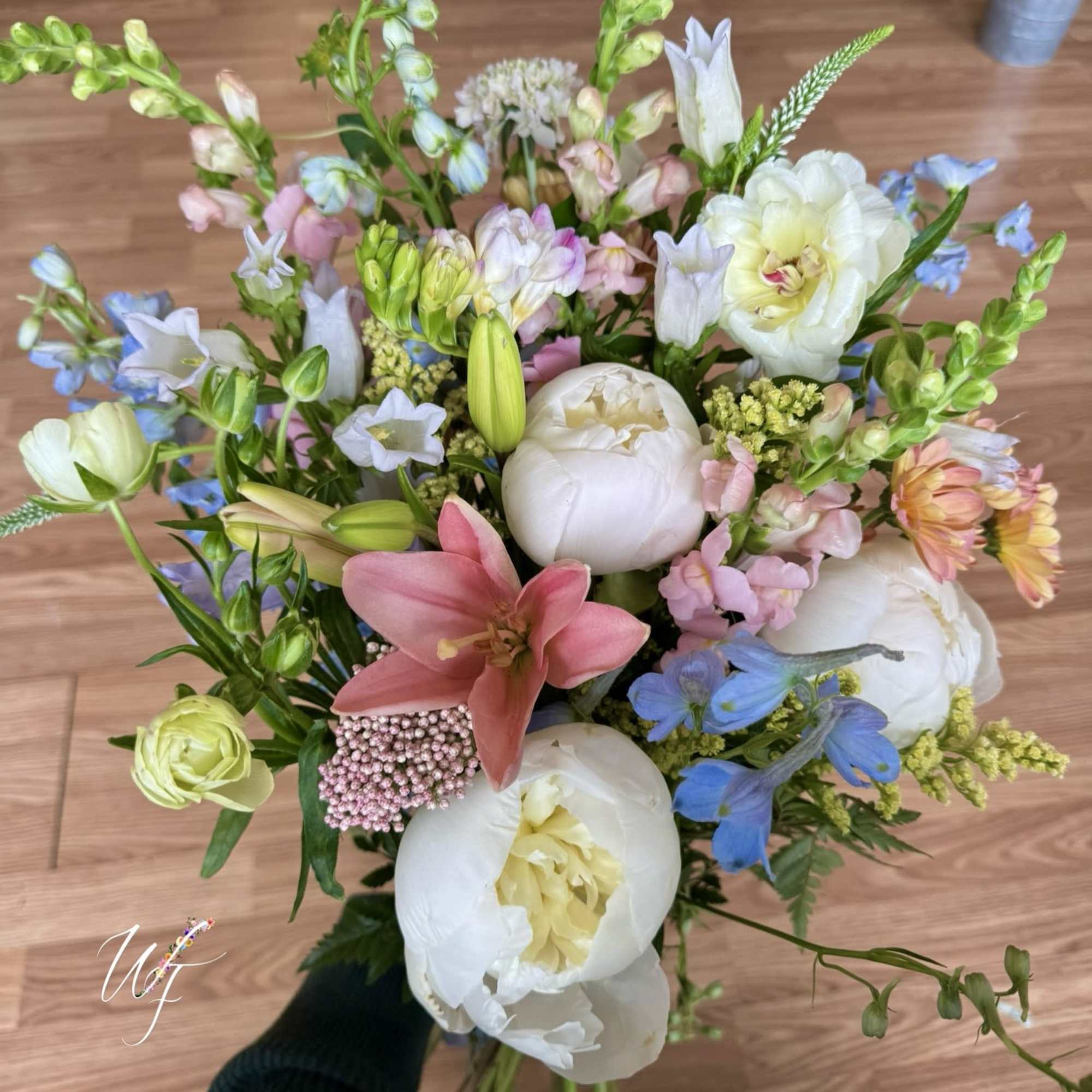 Premium spring blooms hand tied and finished off with a tasteful wrap.