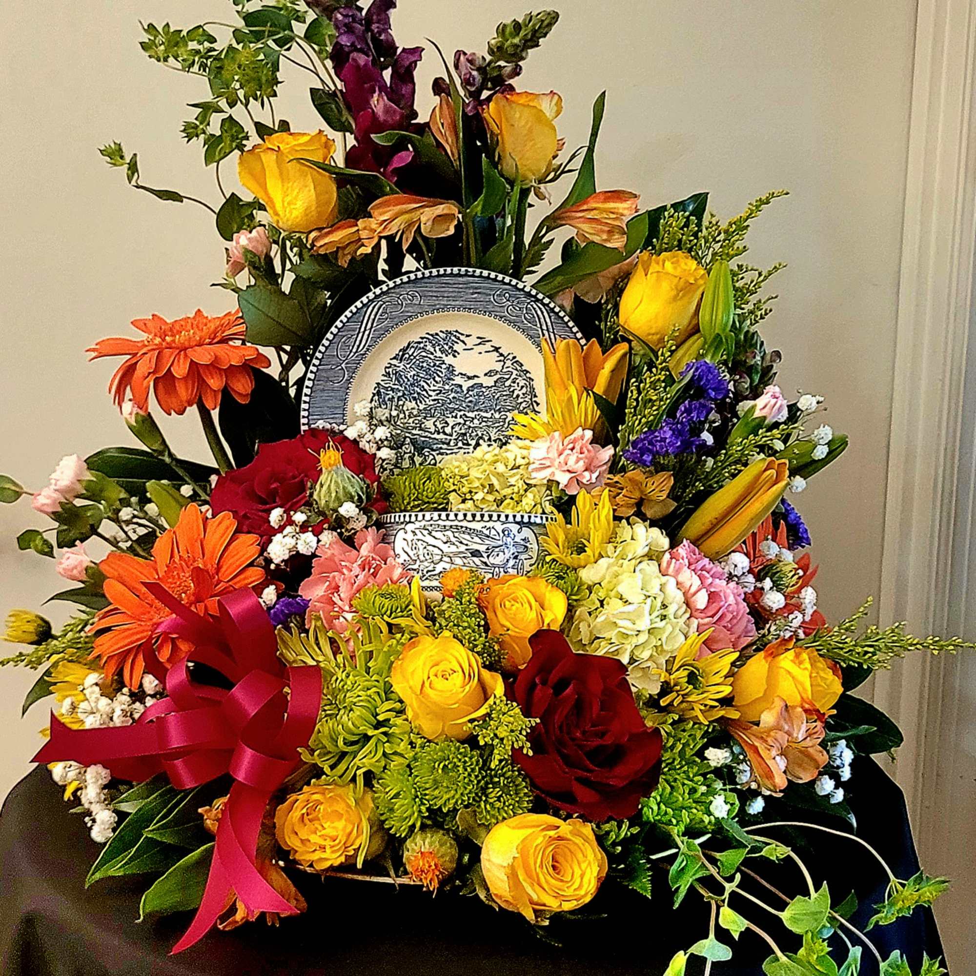 This arrangement is a bright and colorful design with a collection of