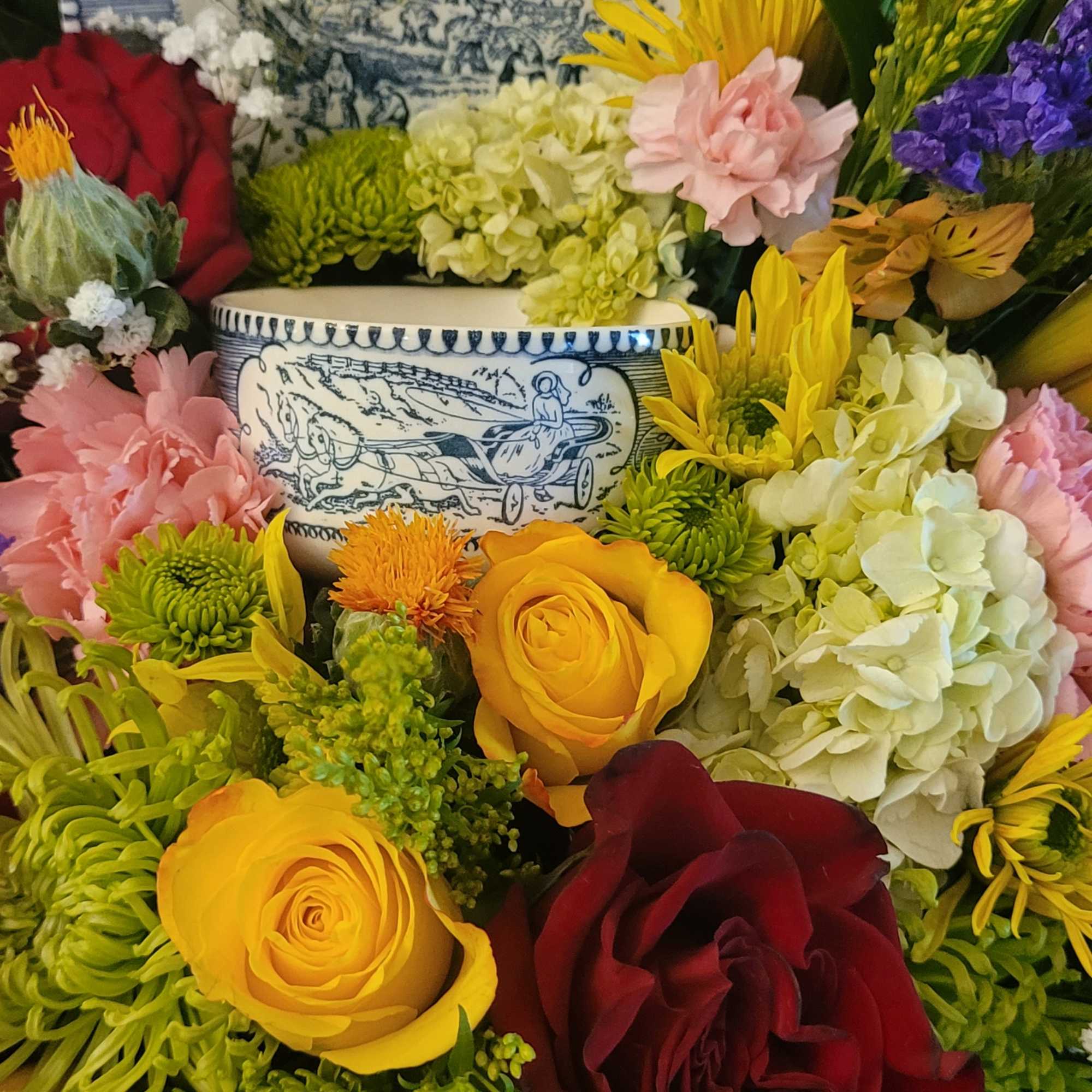 This arrangement is a bright and colorful design with a collection of