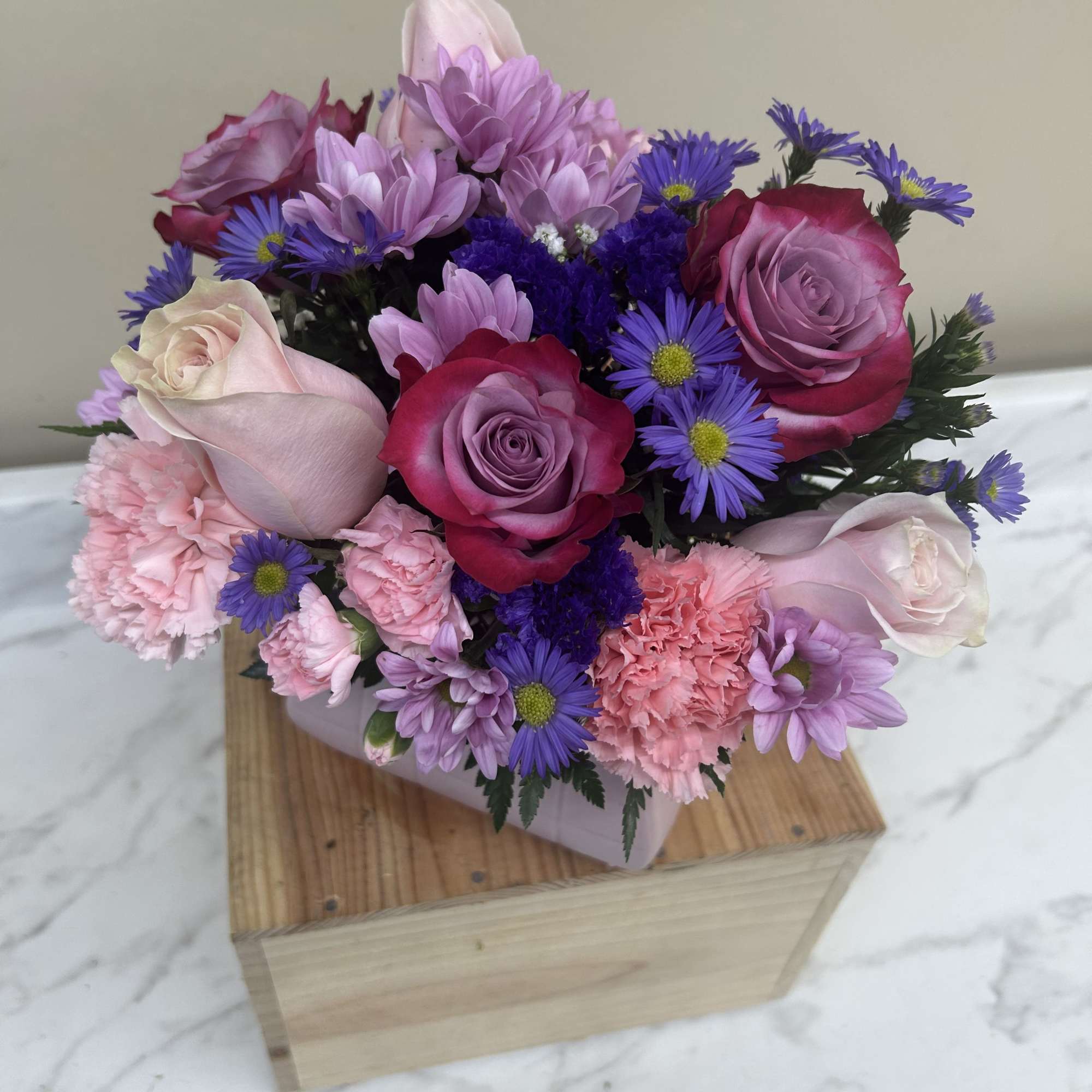 Pink purse, ceramic container with pink and purple flowers