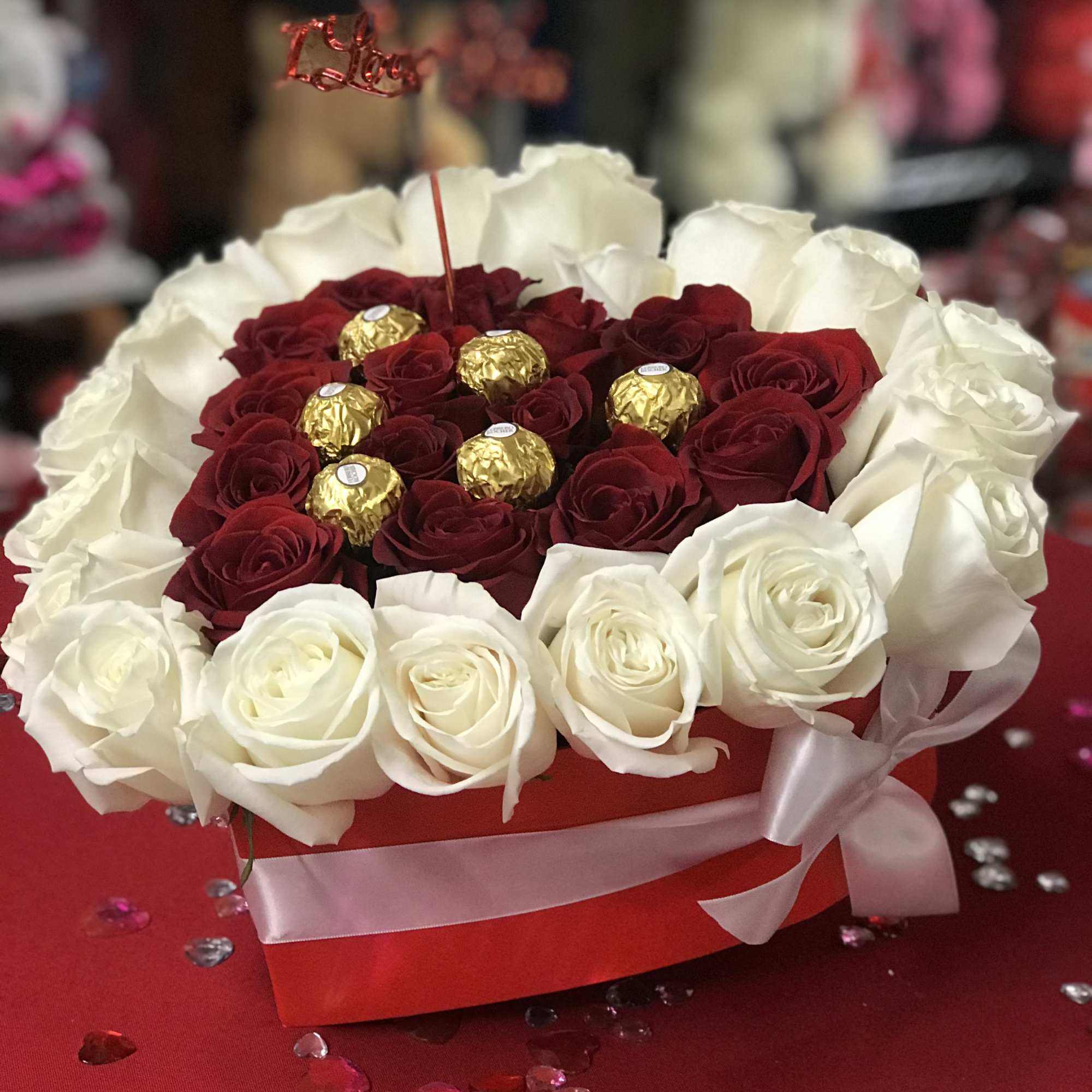 This heart box contains about 35 red and white roses. Perfect for