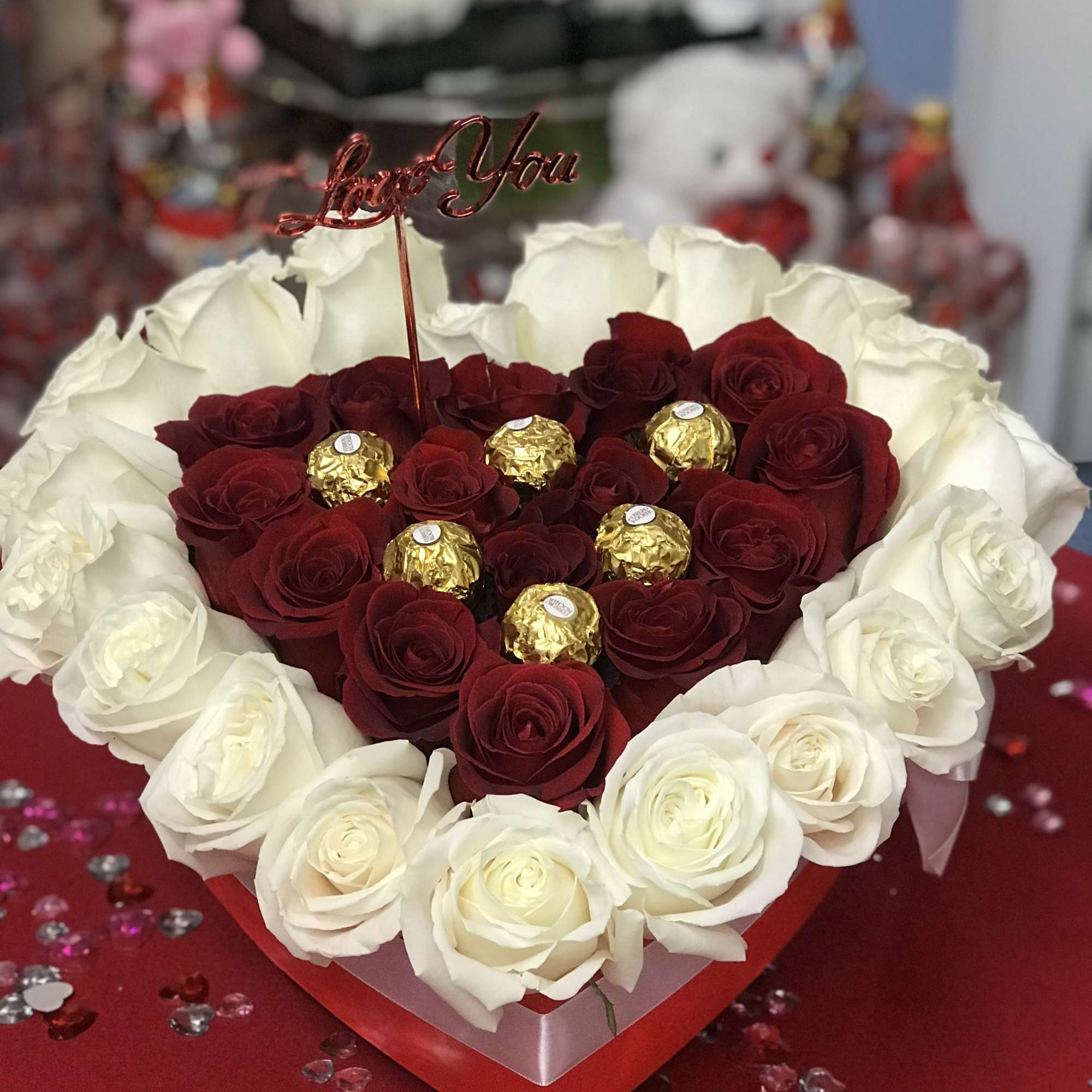 This heart box contains about 35 red and white roses. Perfect for