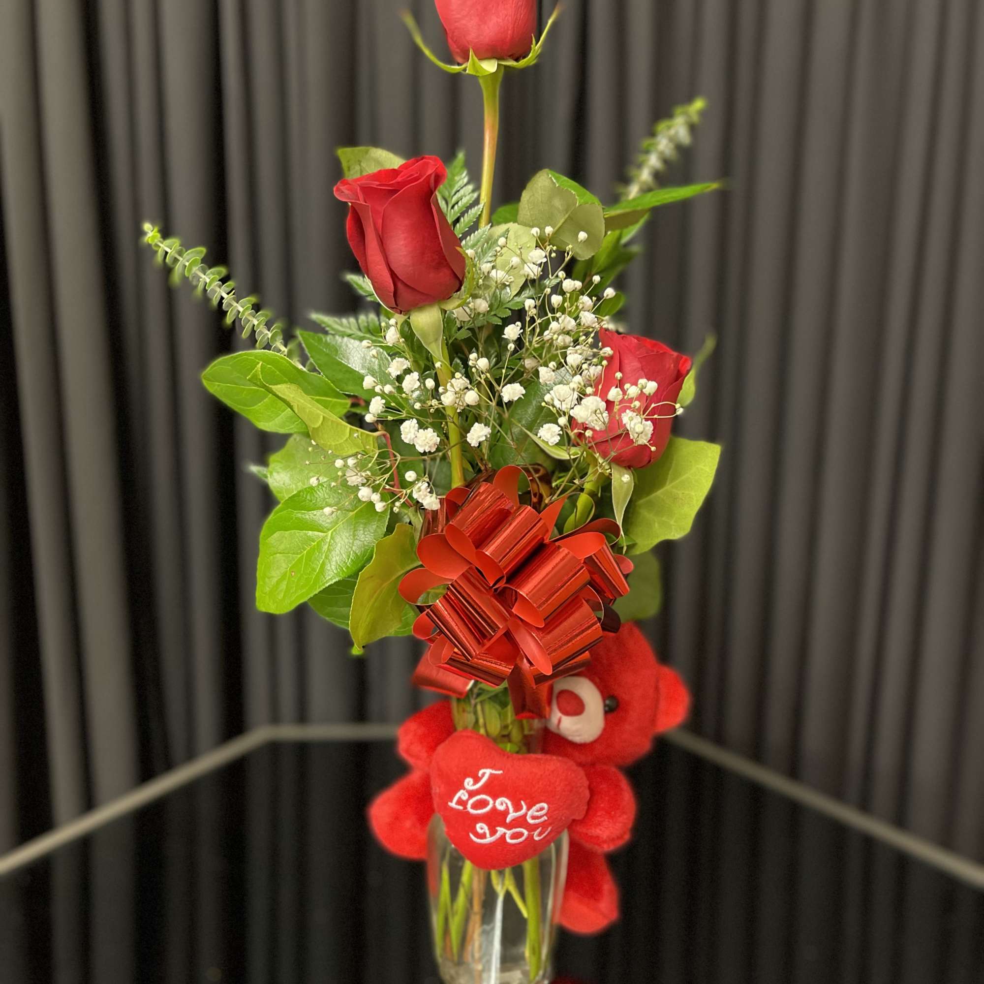 Three rose vase with lemon leaves, baby breath, and eucalyptus. Comes in