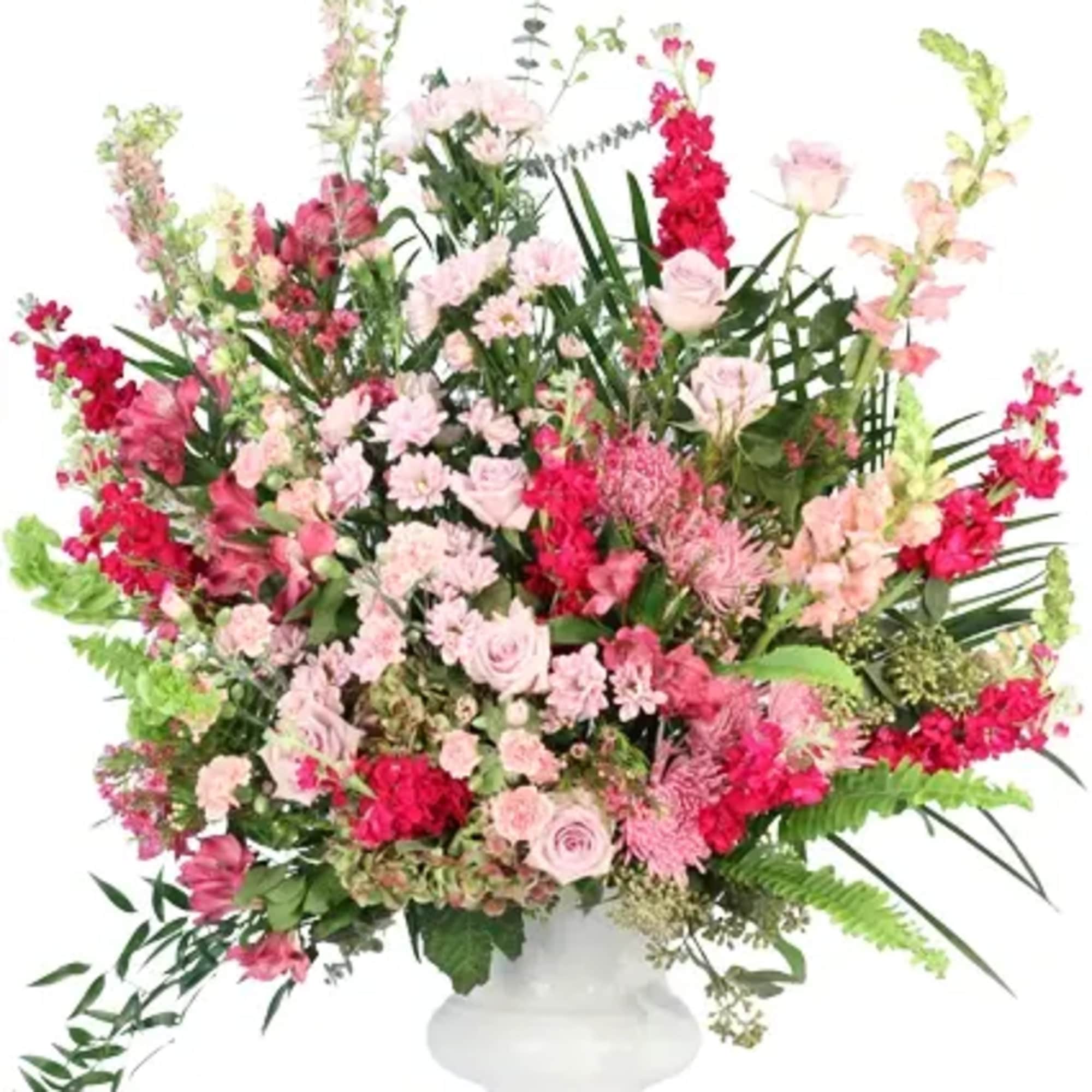 Lift them in support with this stunning arrangement. Featuring a mix of